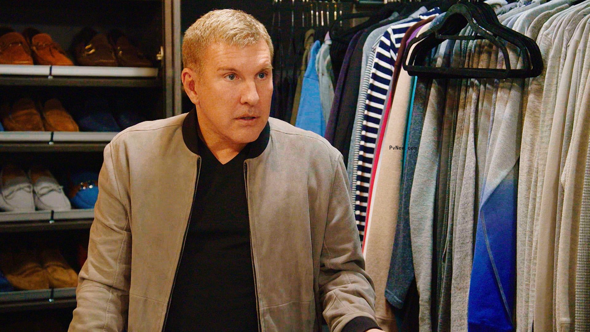 Todd Chrisley in a closet in a scene from 