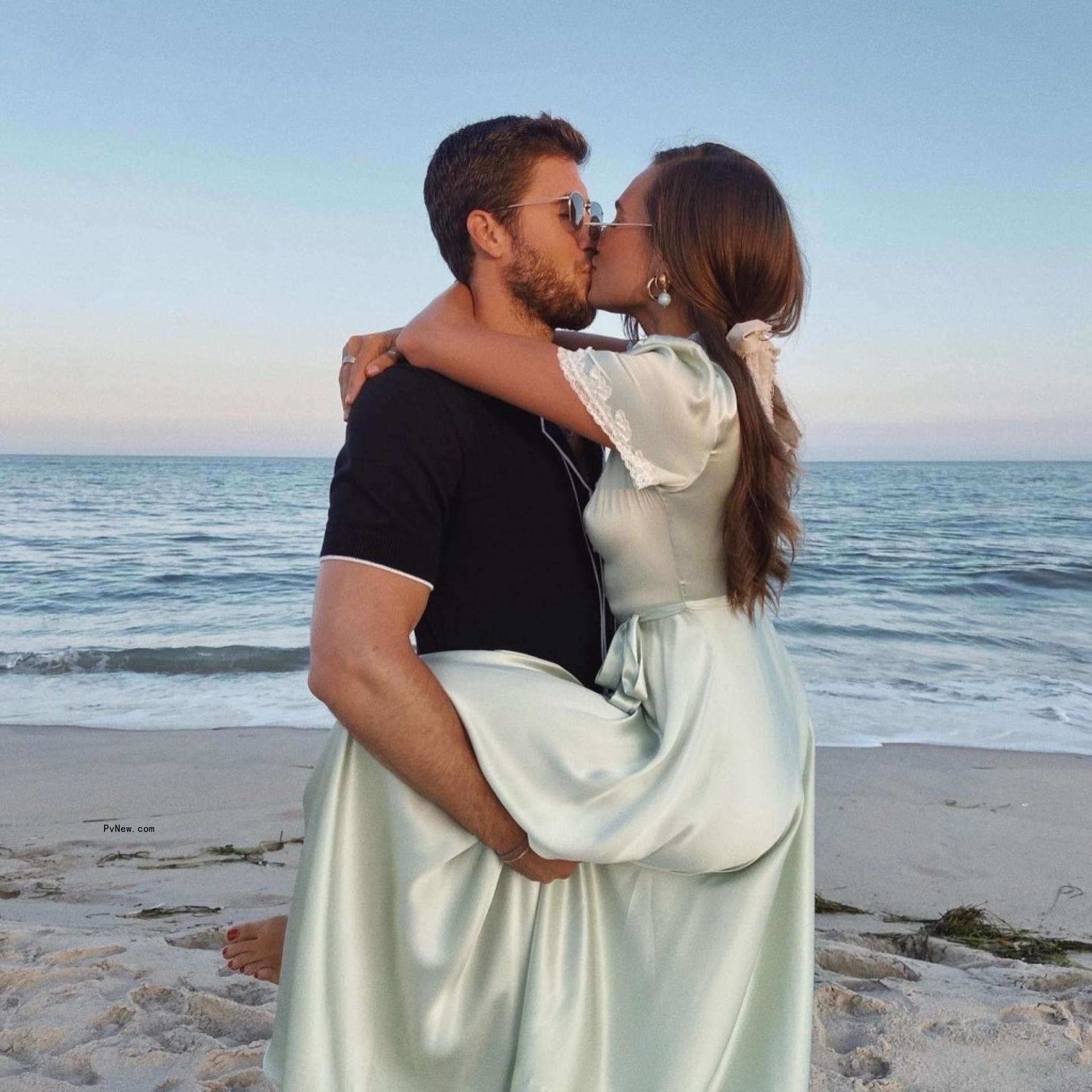 Anthony Adler and Danielle Bernstein kissing.