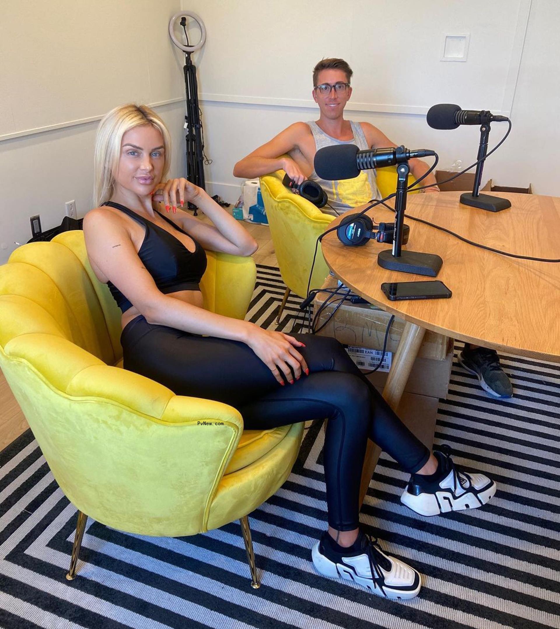 Lala Kent sitting with a guest on her podcast