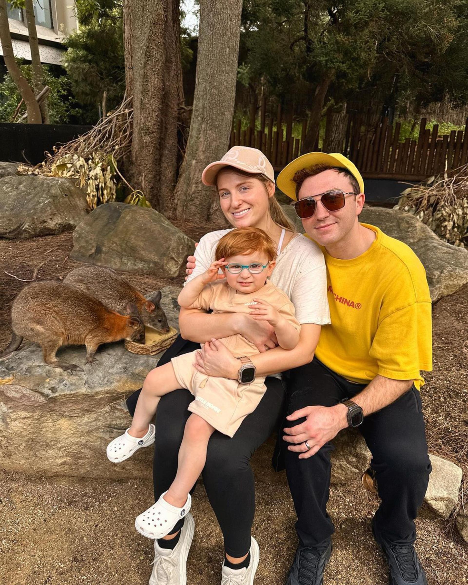 Meghan Trainor and Daryl Sabara sit with son Riley