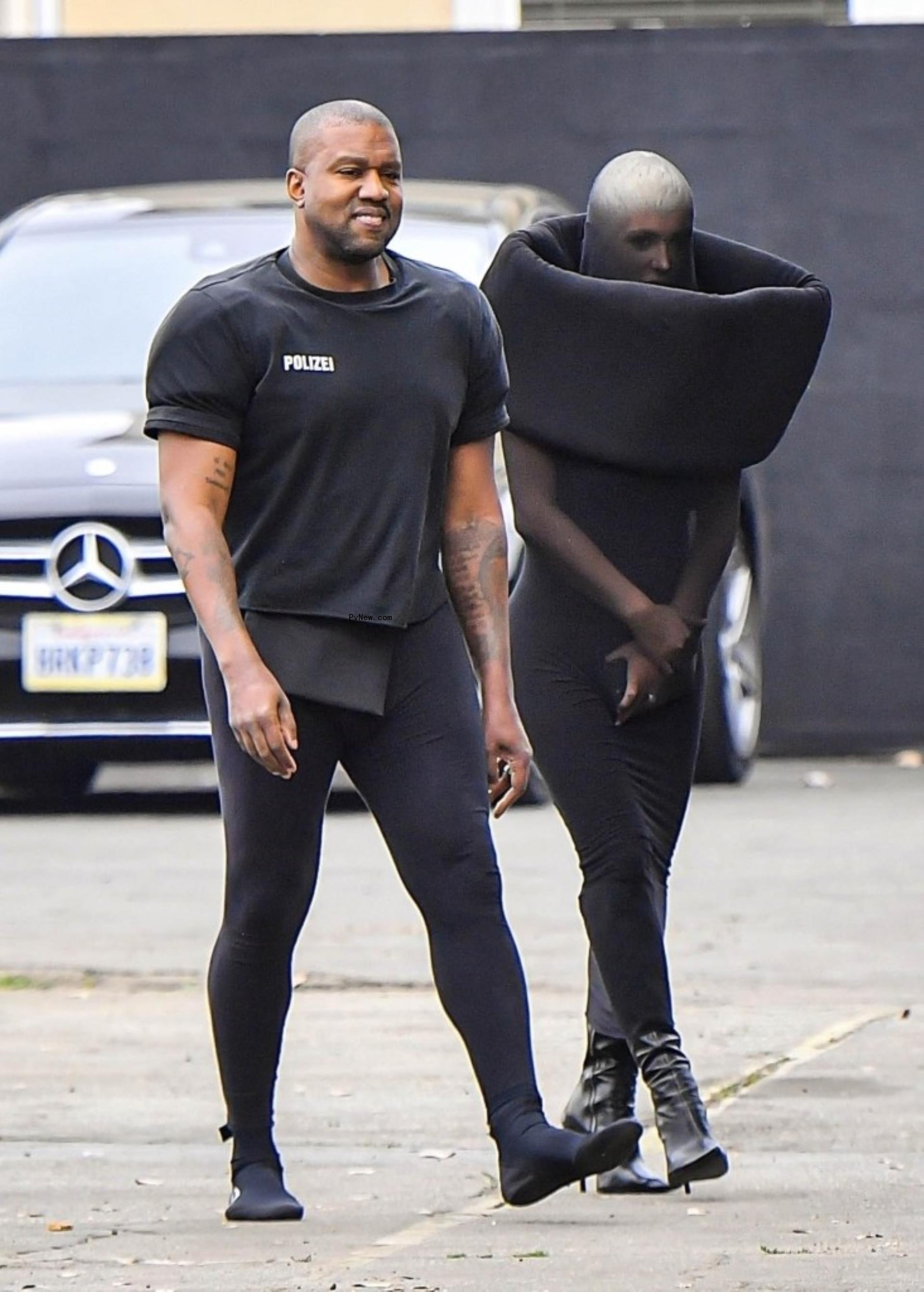 kanye west and bianca censori dressed in a condom-like outfit
