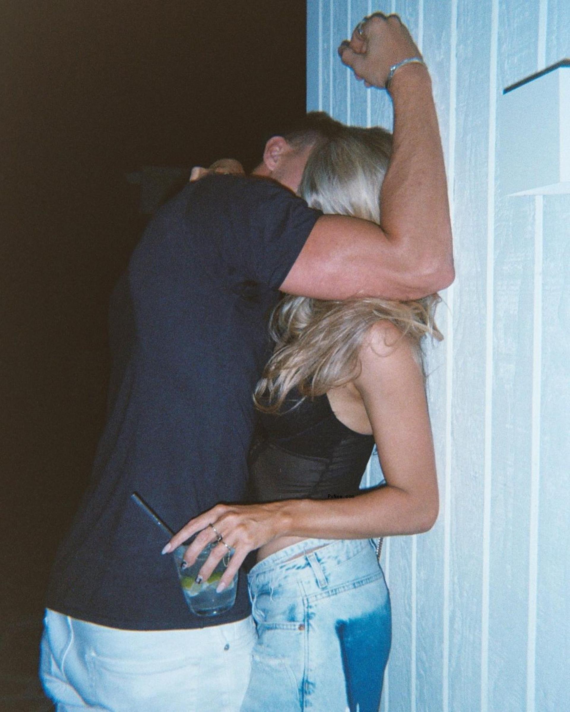 Kory Keefer and Sam Feher making out against a wall