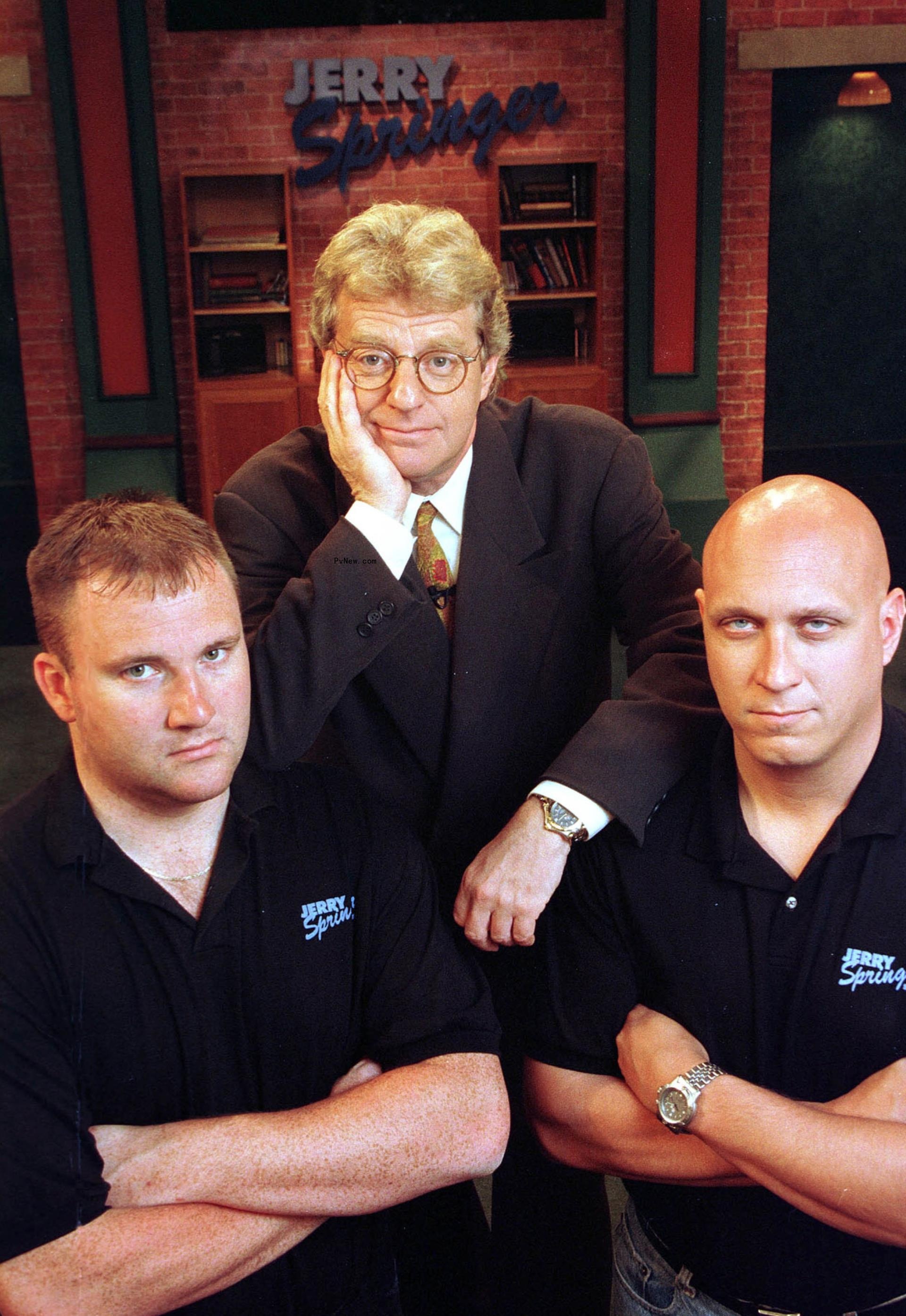 Jerry Springer and two of  his bodyguards.