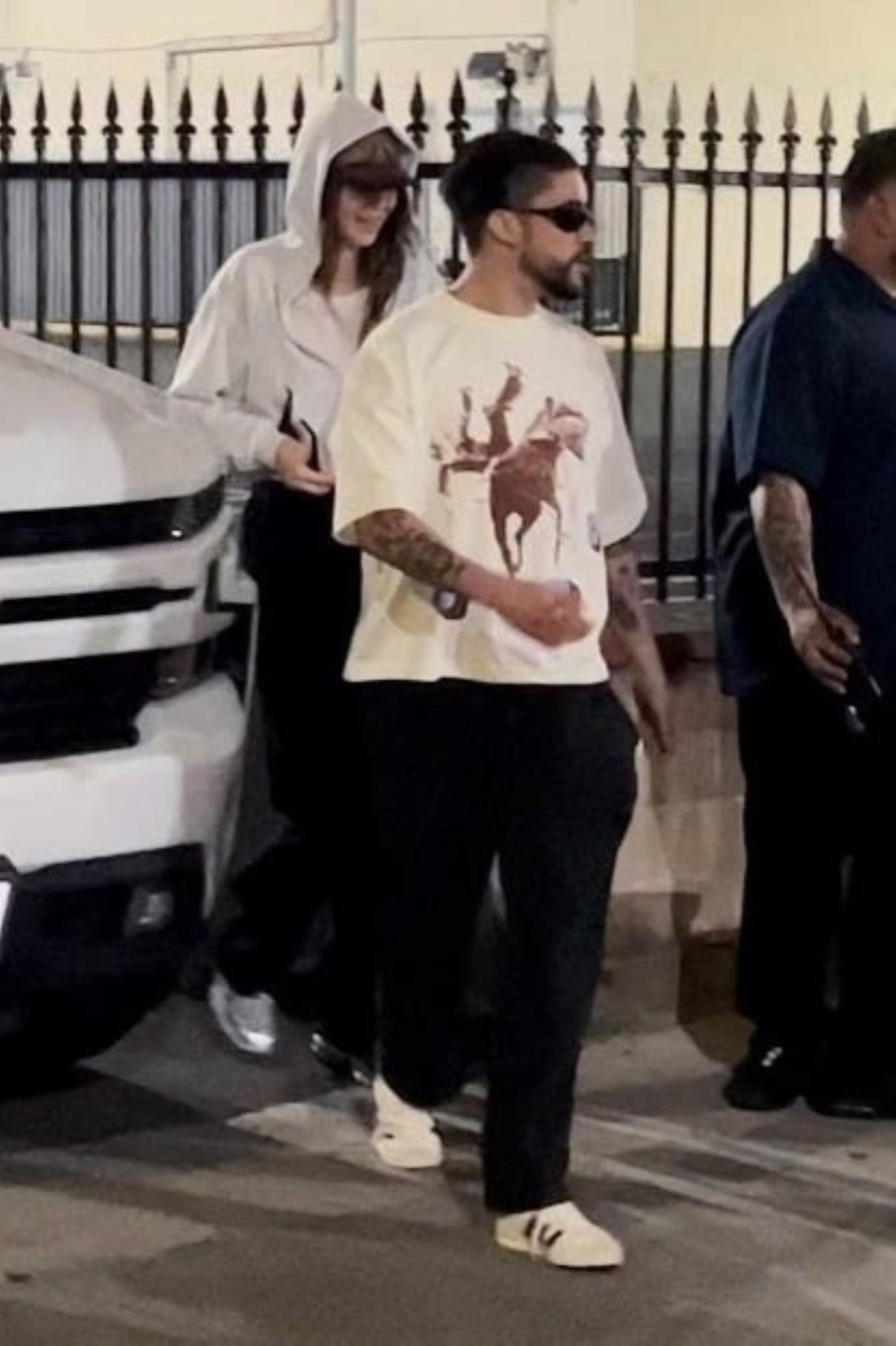 Kendall Jenner and Bad Bunny leaving Tyler, the Creator's show.
