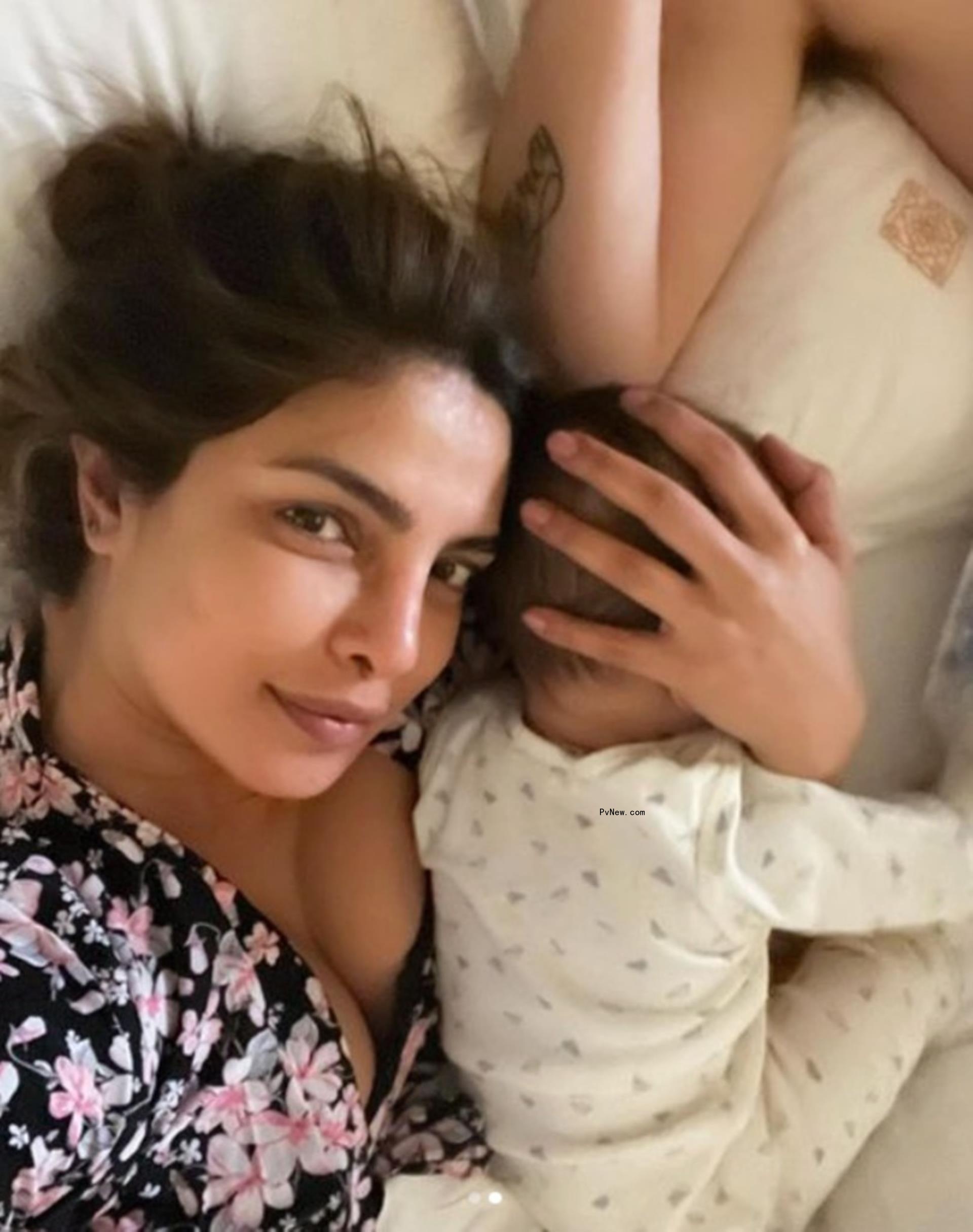 Priyanka Chopra cradling her daughter, Malti. 
