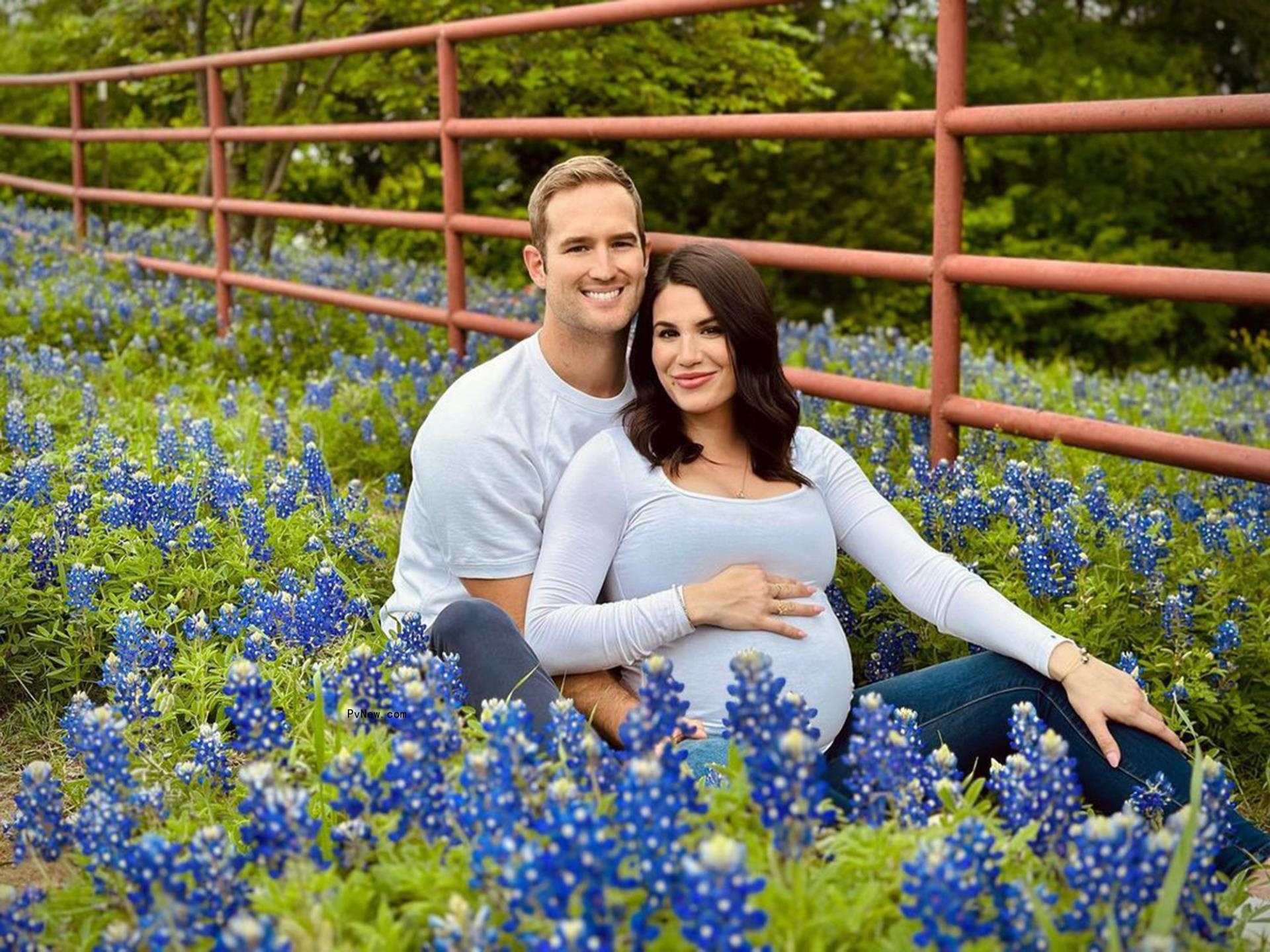 morgan chesky cradling a pregnant jane steele in a field