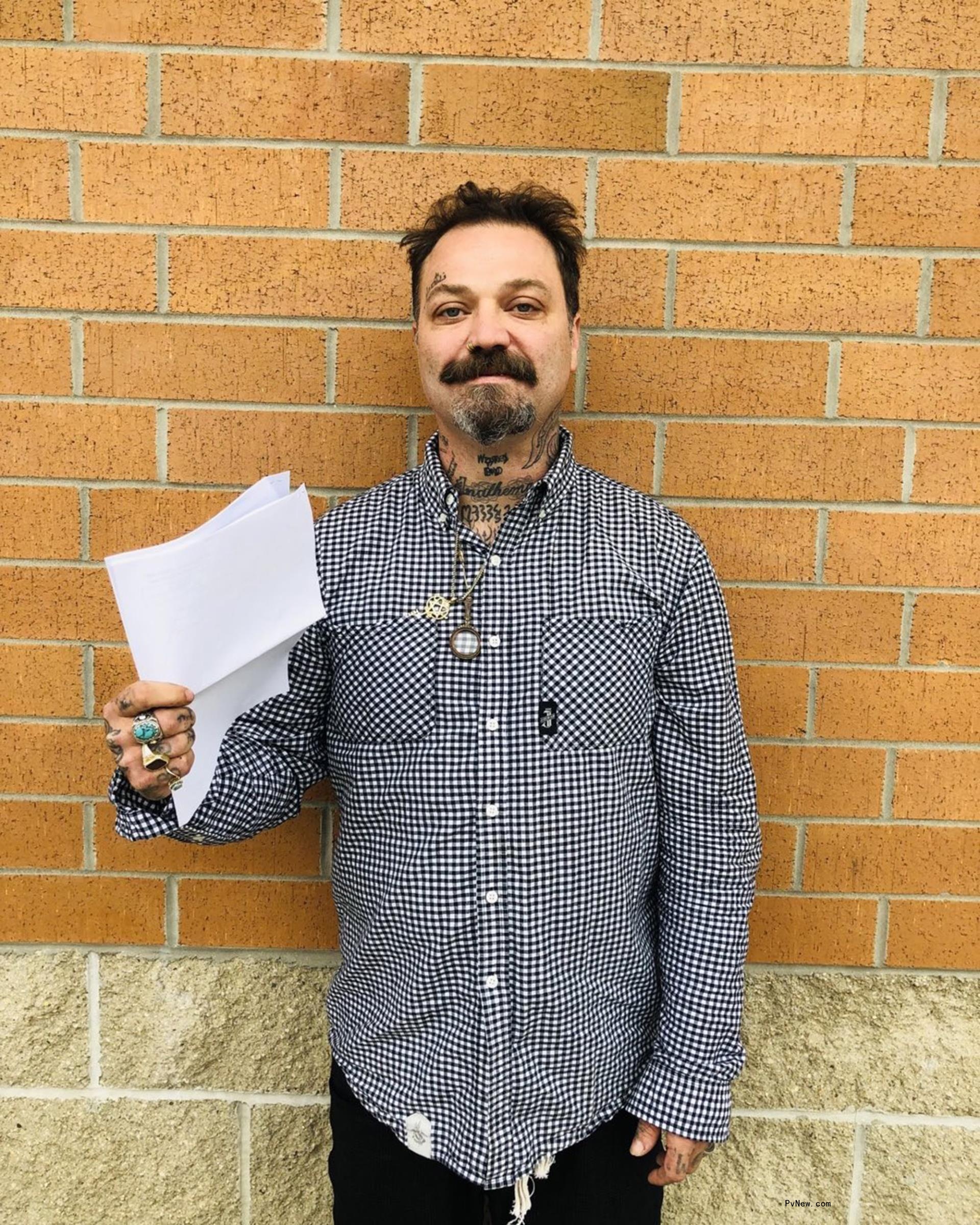 Bam Margera posing outside of court.