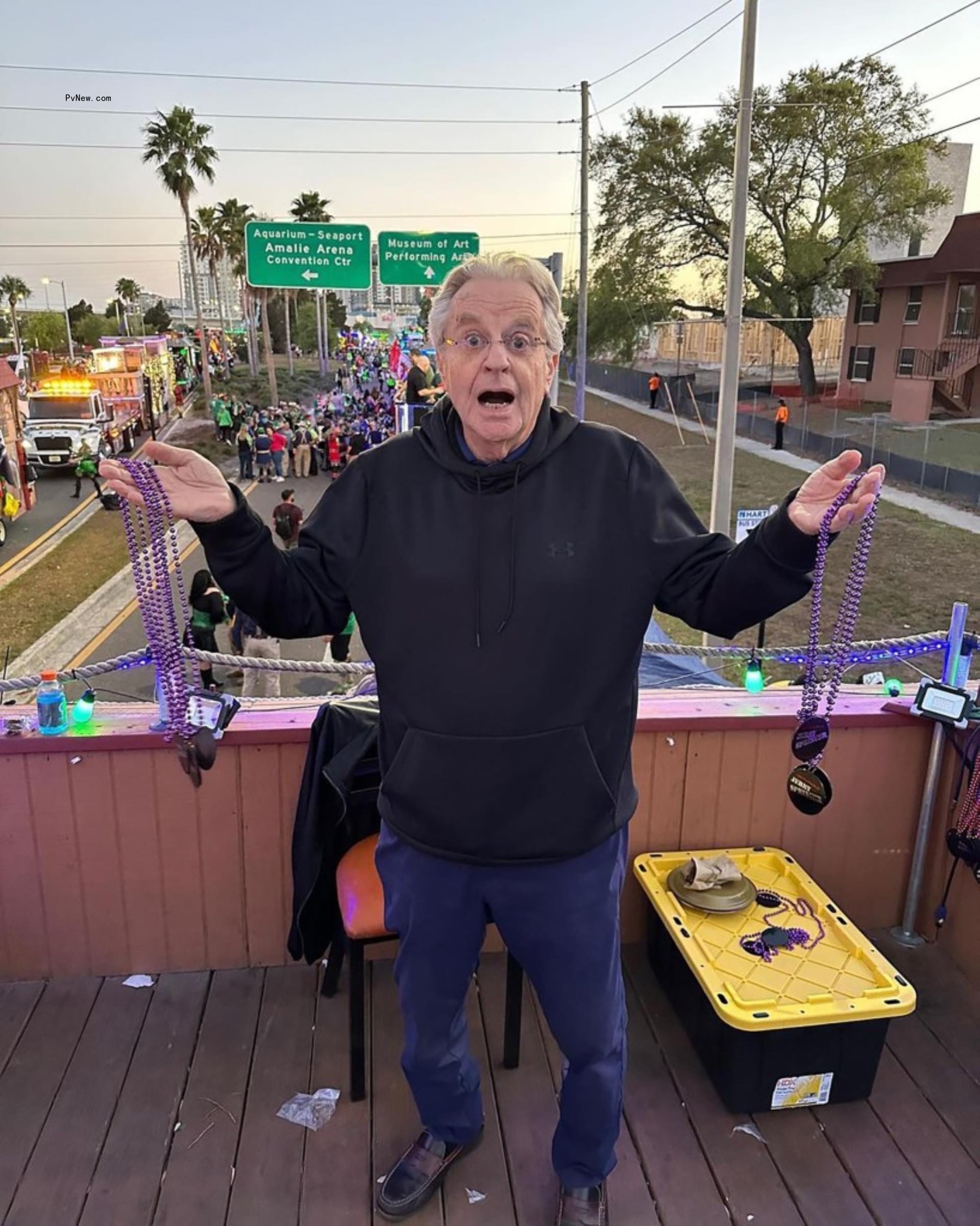 jerry springer standing on an overpass