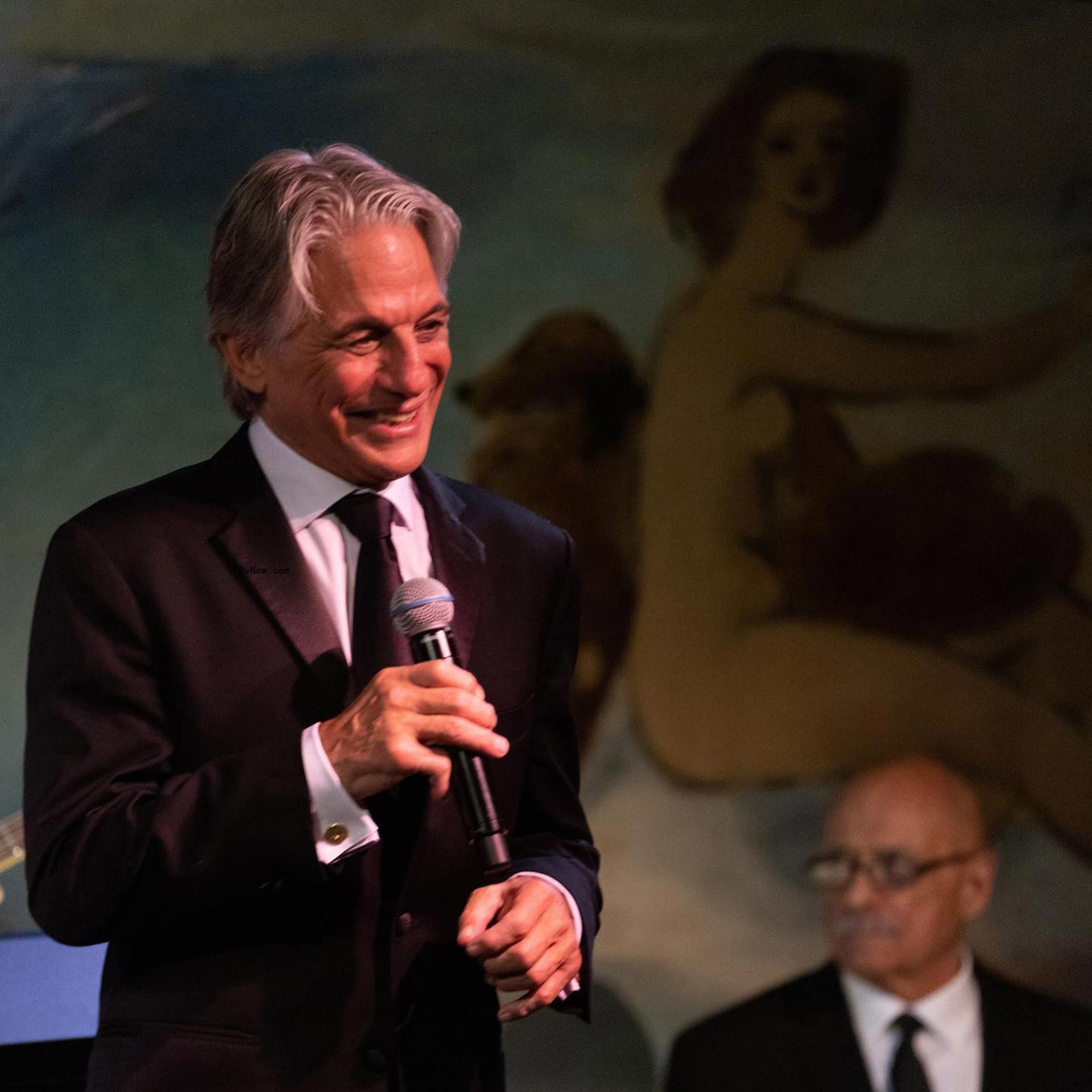 Tony Danza speaks into mic