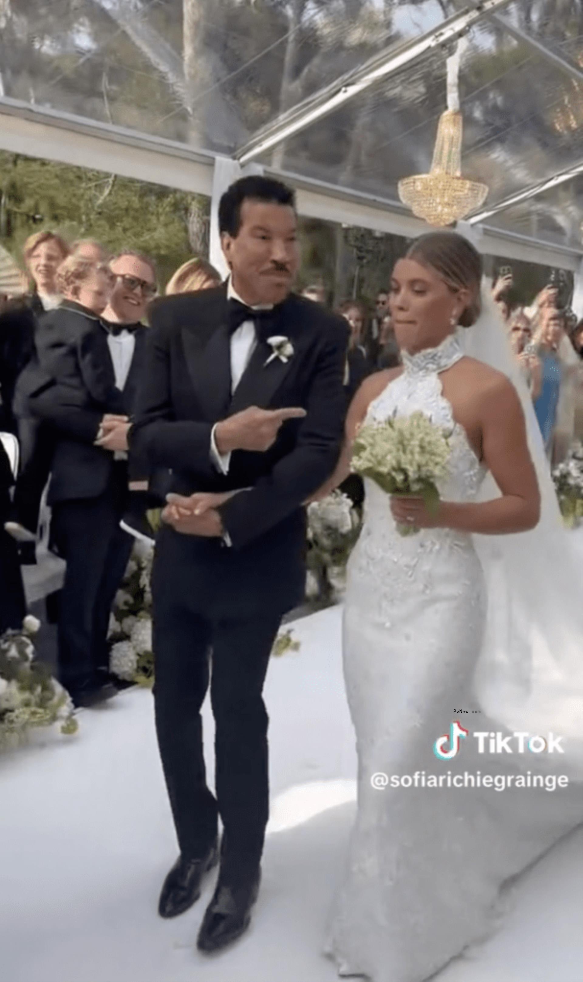 Lio<i></i>nel Richie walking Sofia Richie down the aisle.