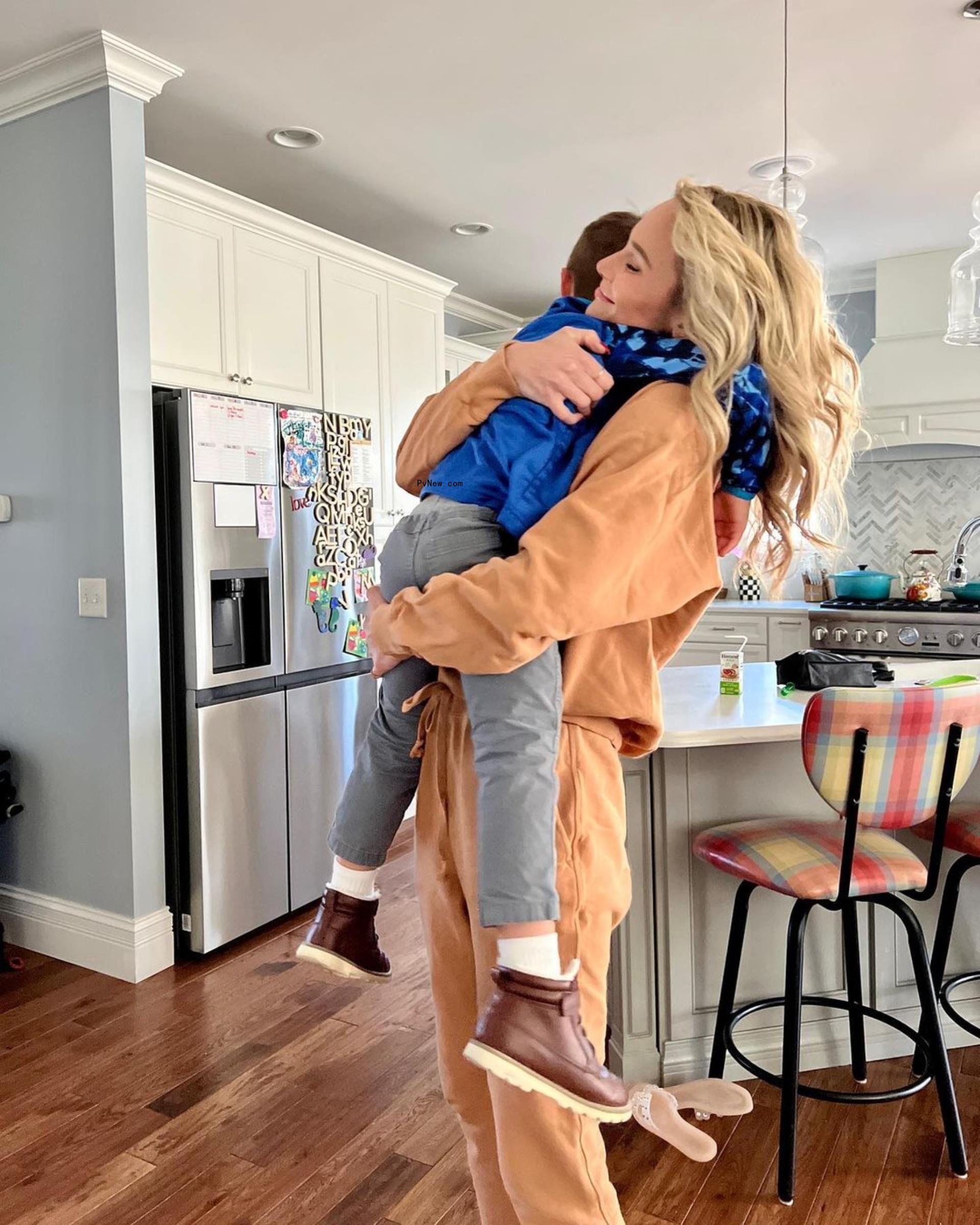 Meghan King holds son