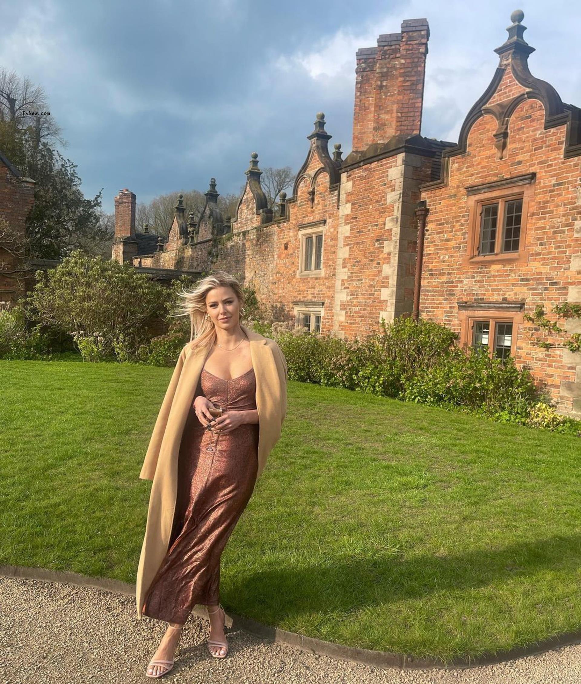 Ariana Madix poses in brown dress