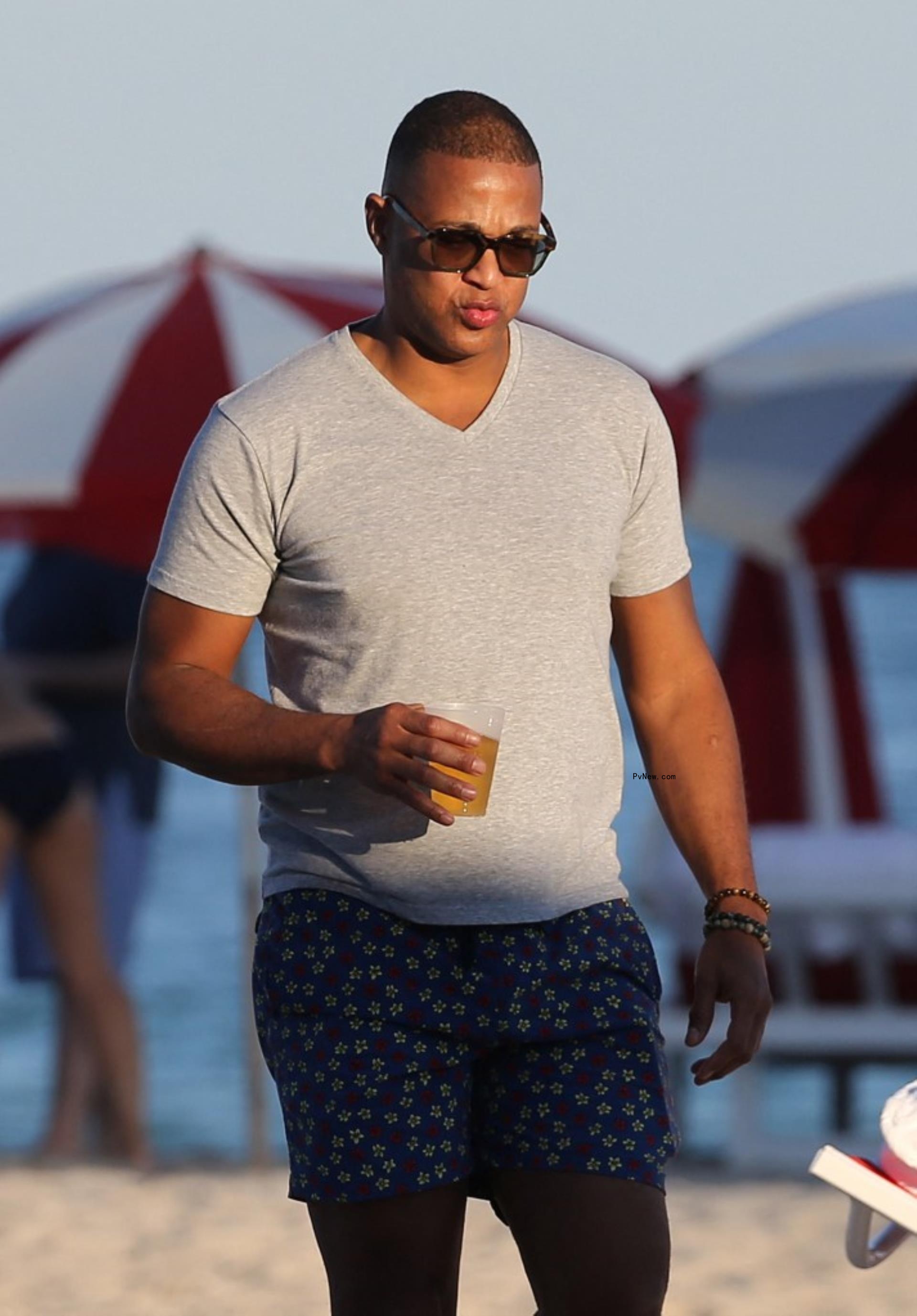 Don lemon walking on the beach.