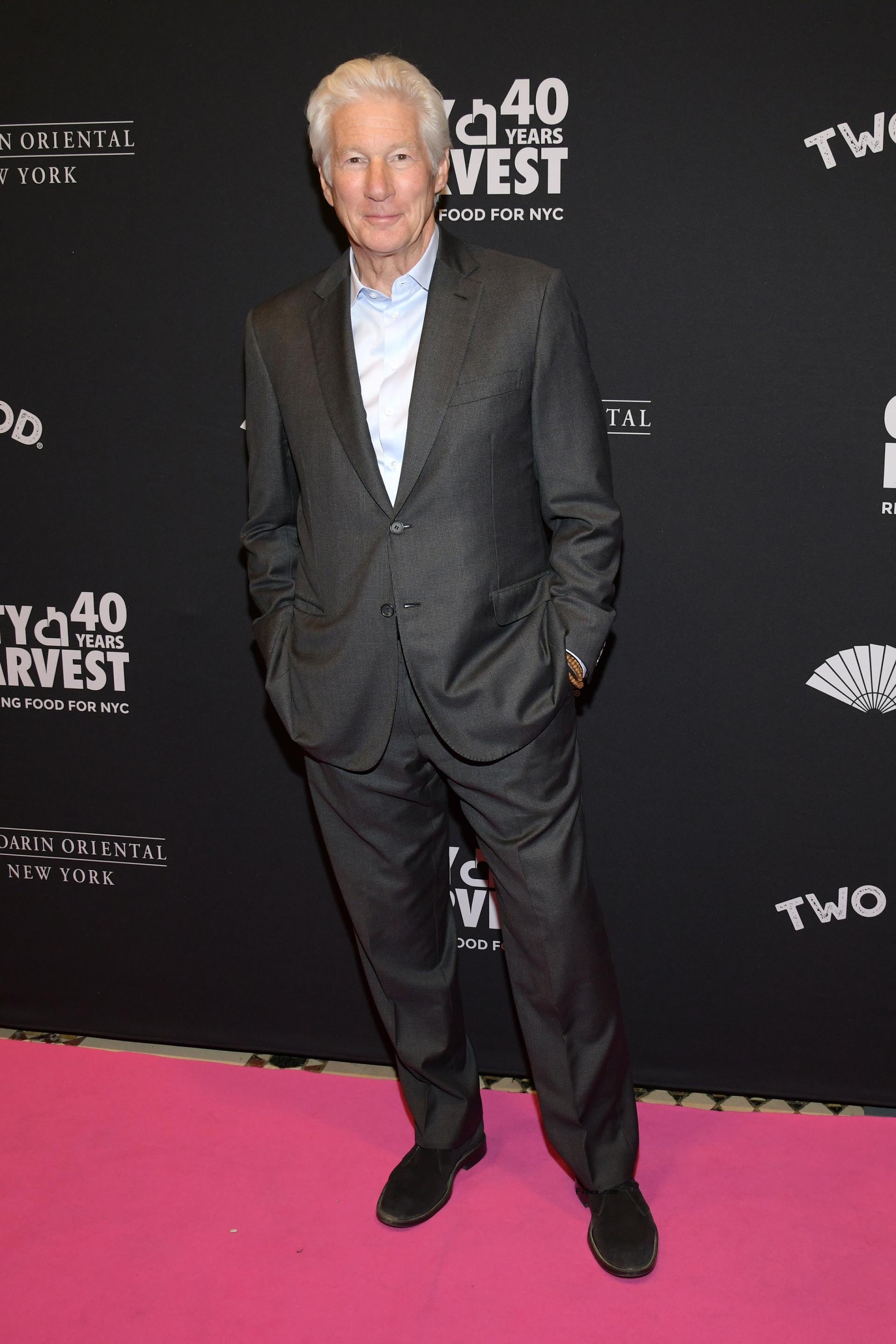 Richard Gere posing on the red carpet at the City Harvest Gala.