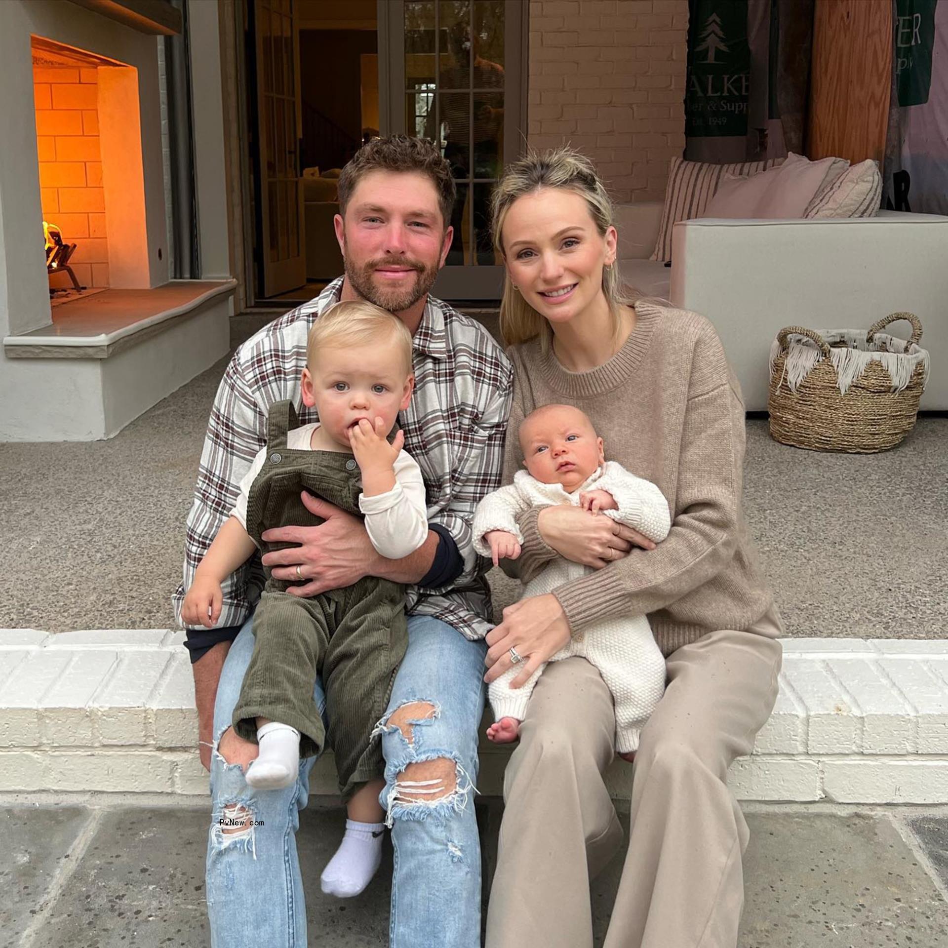 Lauren Bushnell and Chris Lane sitting with their two sons