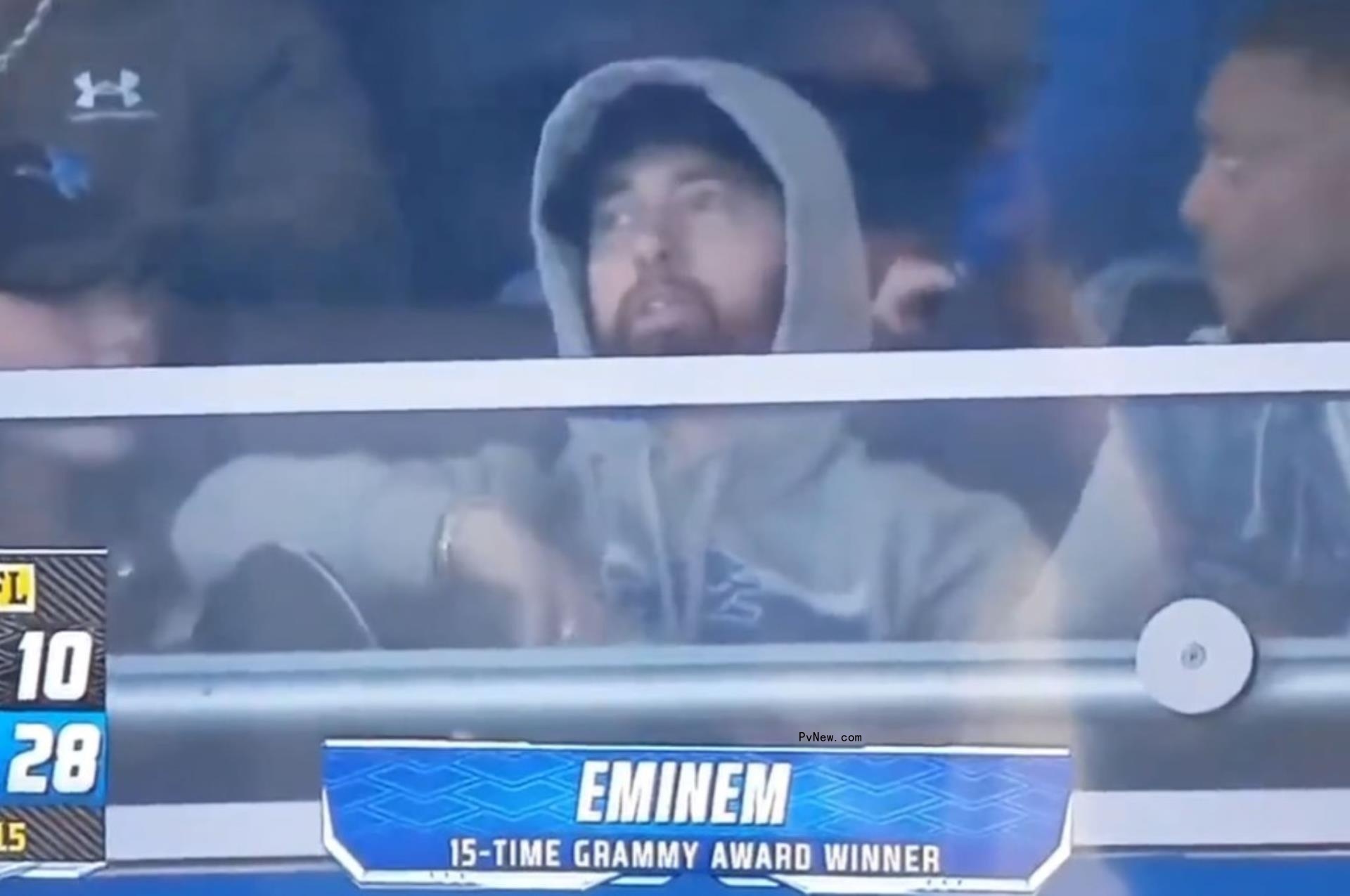 hailie mathers, eminem, denaun porter in an NFL suite