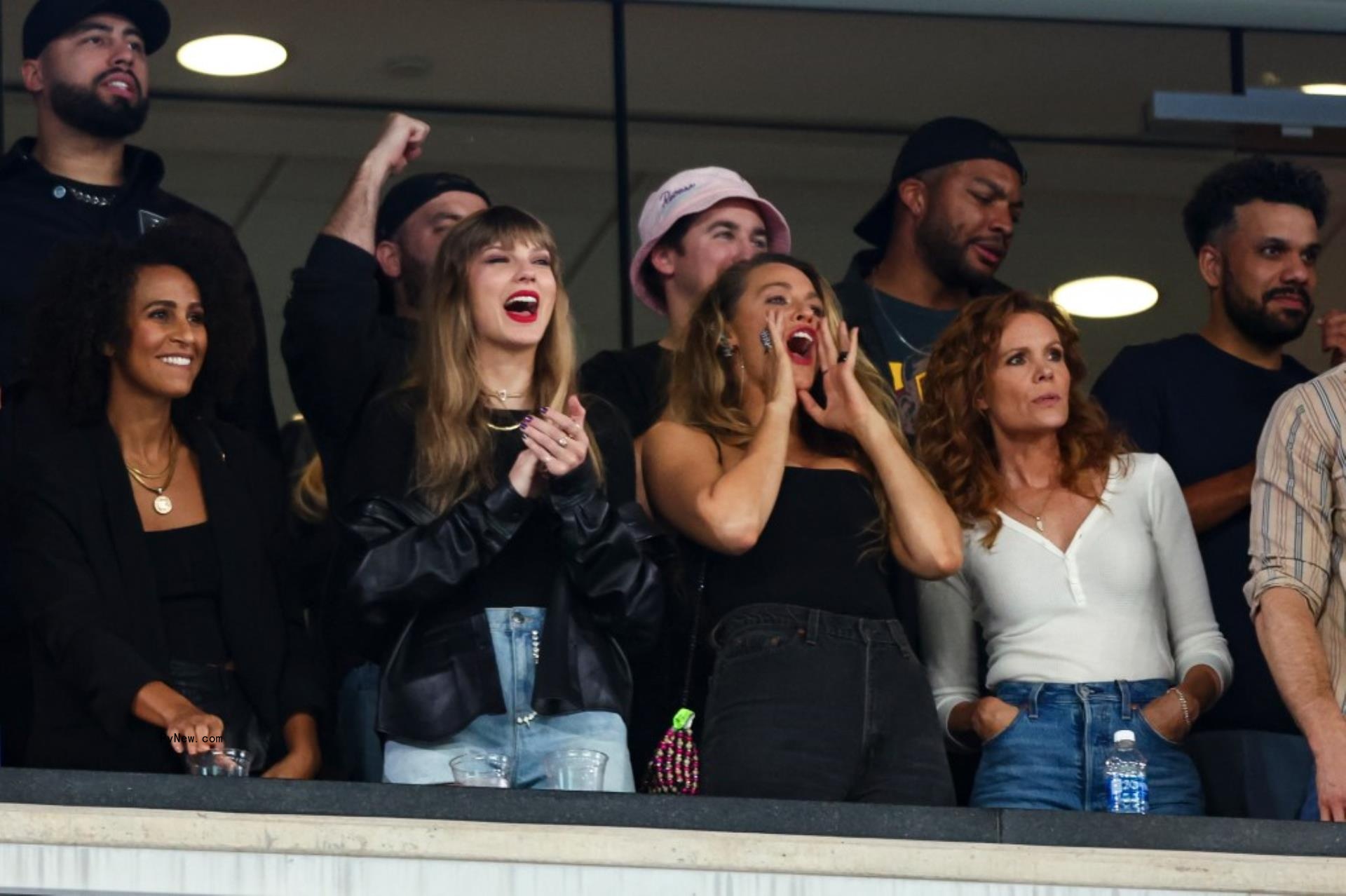 A photo of Taylor Swift cheering on Travis Kelce