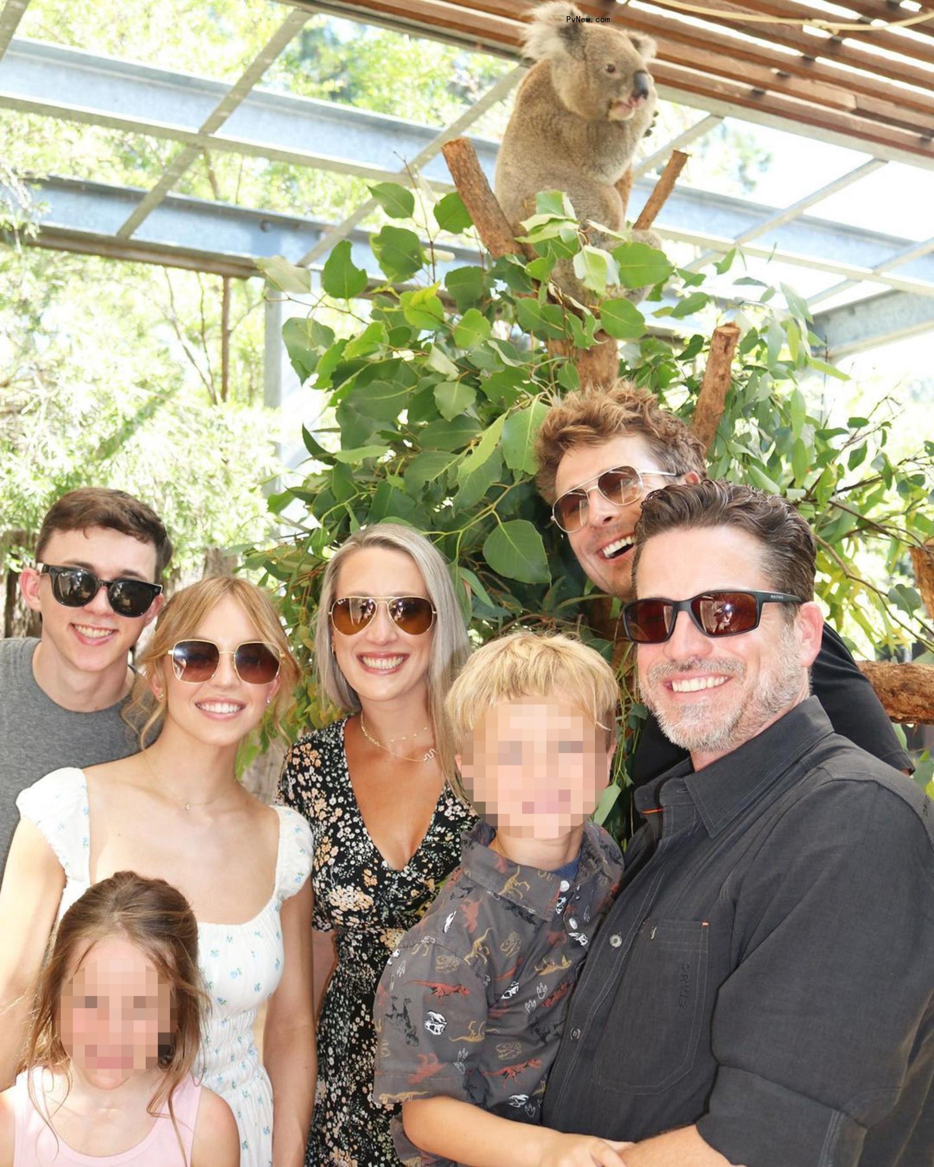Glen Powell and his family with Sydney Sweeney at the zoo.