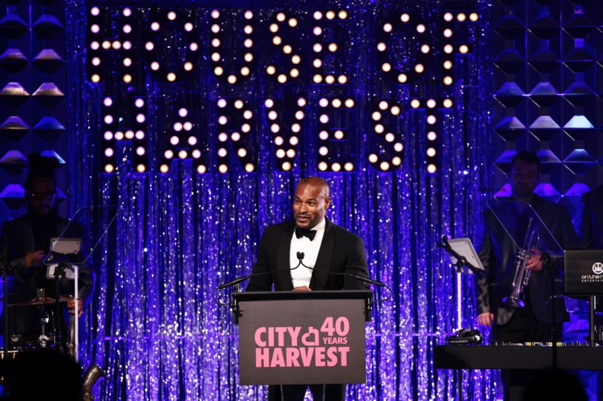Tyson Beckford on stage as host for City Harvest Gala.