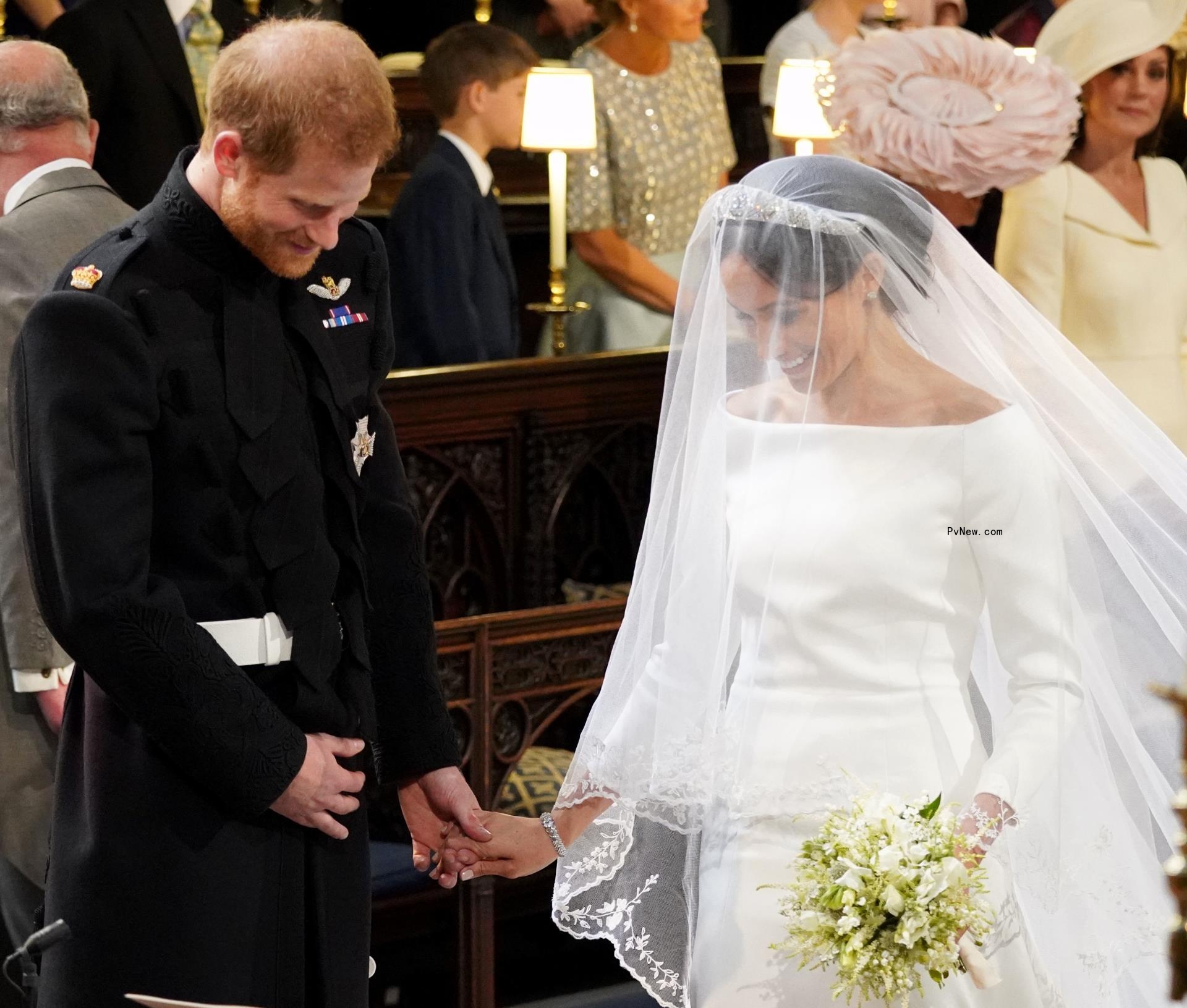 Prince Harry and Meghan Markle stand at the altar 