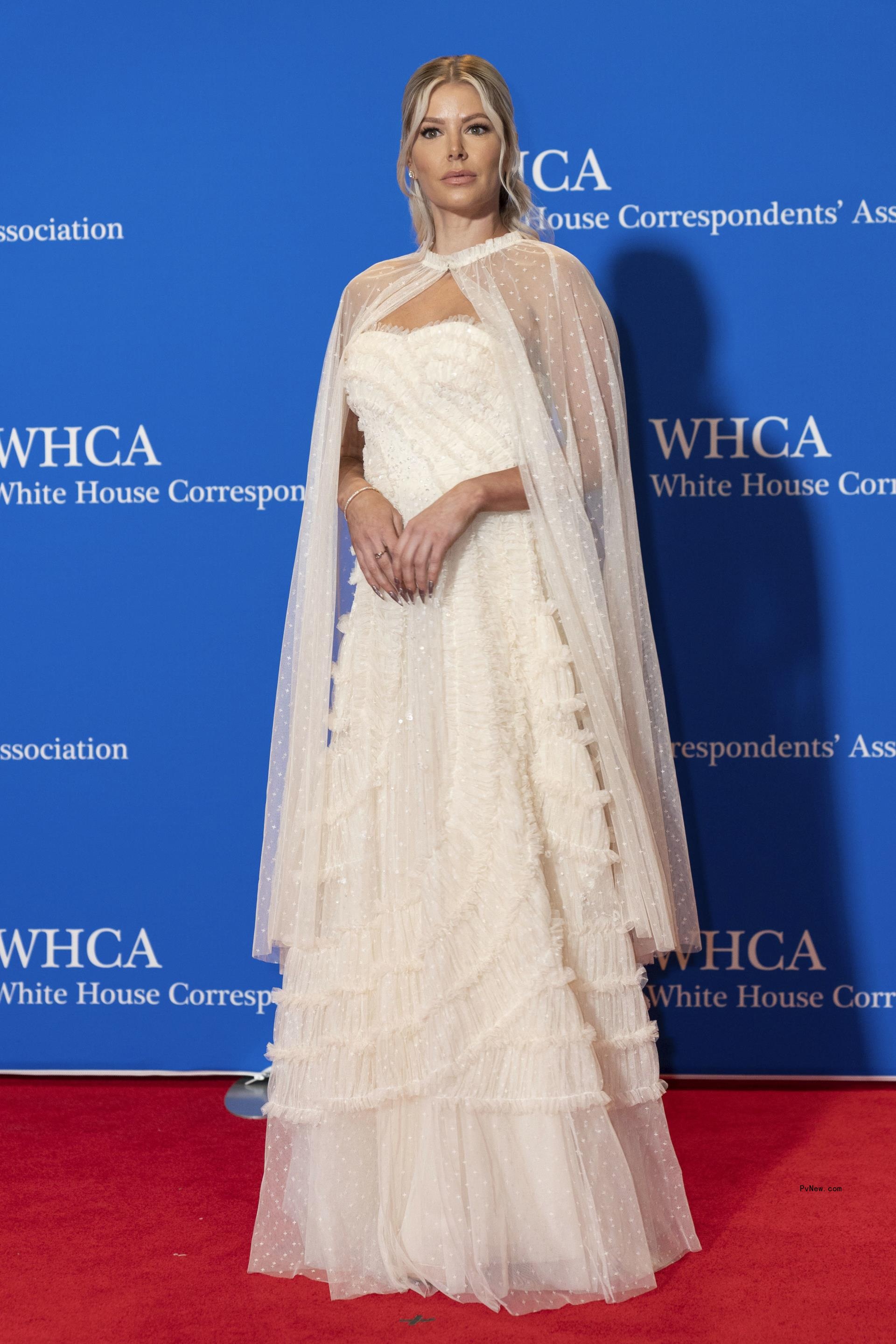 Ariana Madix poses in a white dress in DC