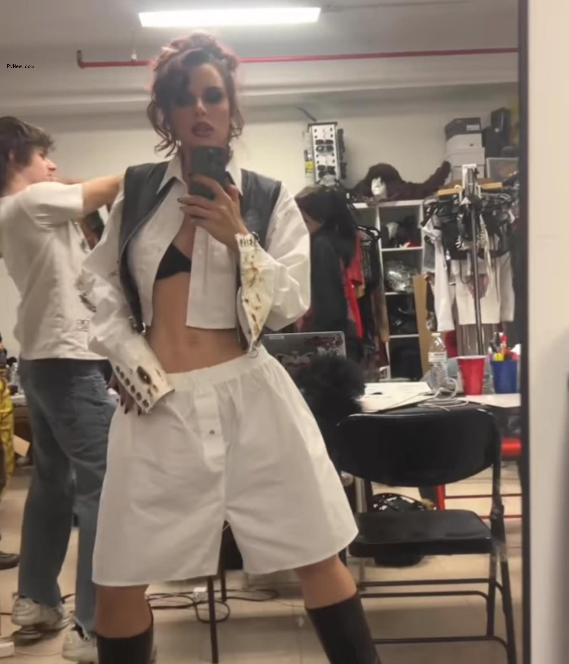 Julia Fox taking a mirror selfie.