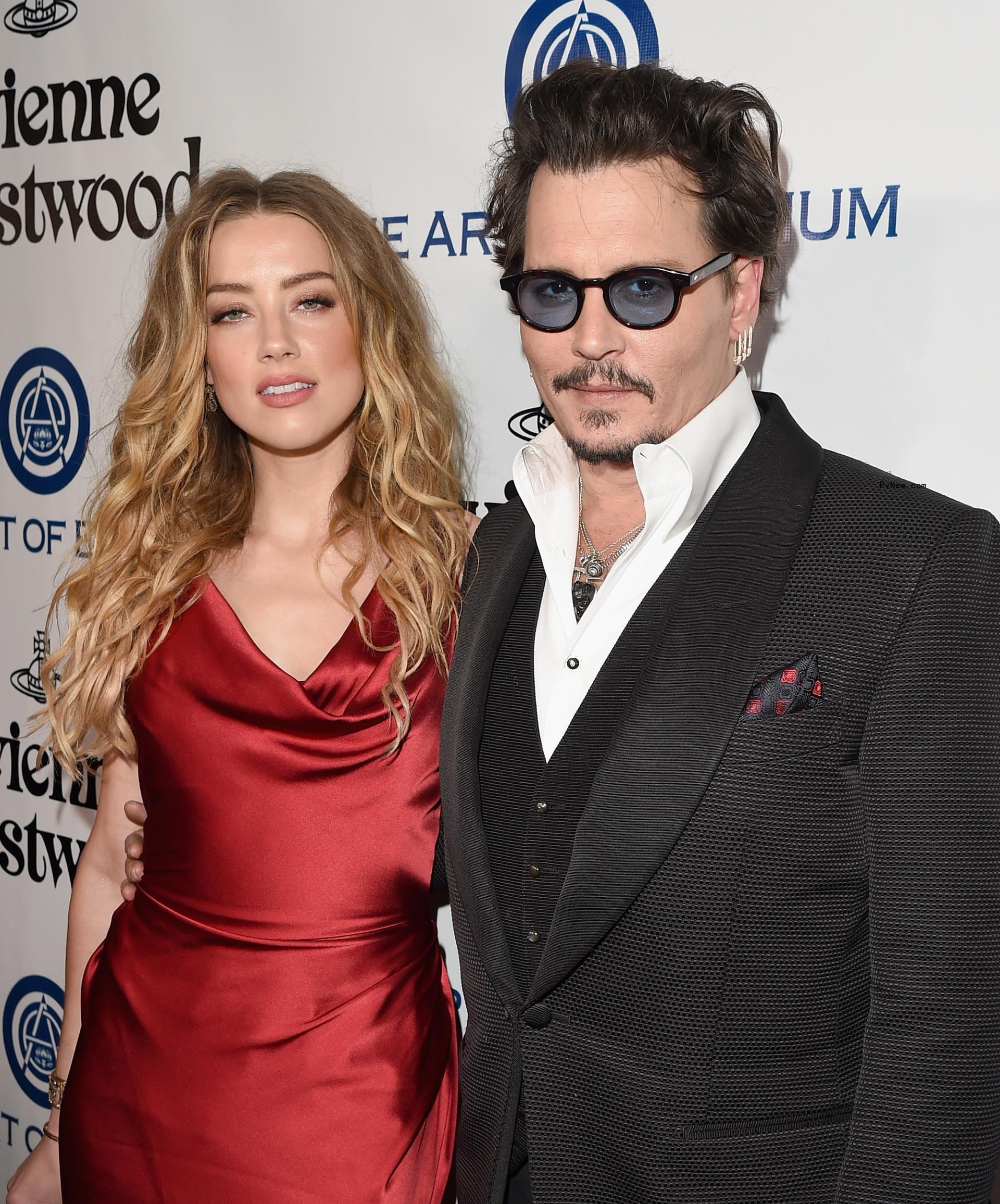 Amber Heard and Johnny Depp at a red carpet event.