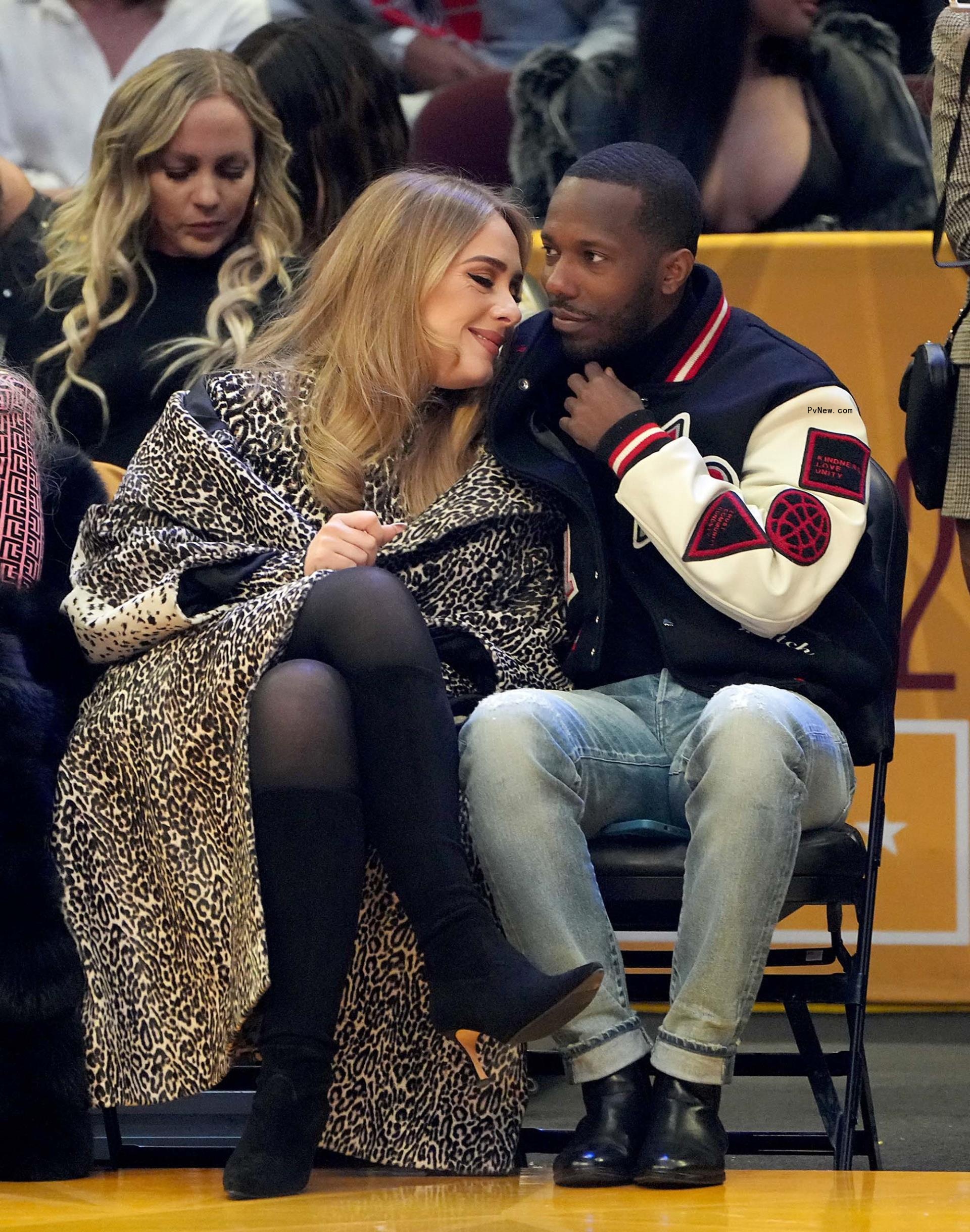 Rich Paul and Adele sitting courtside.