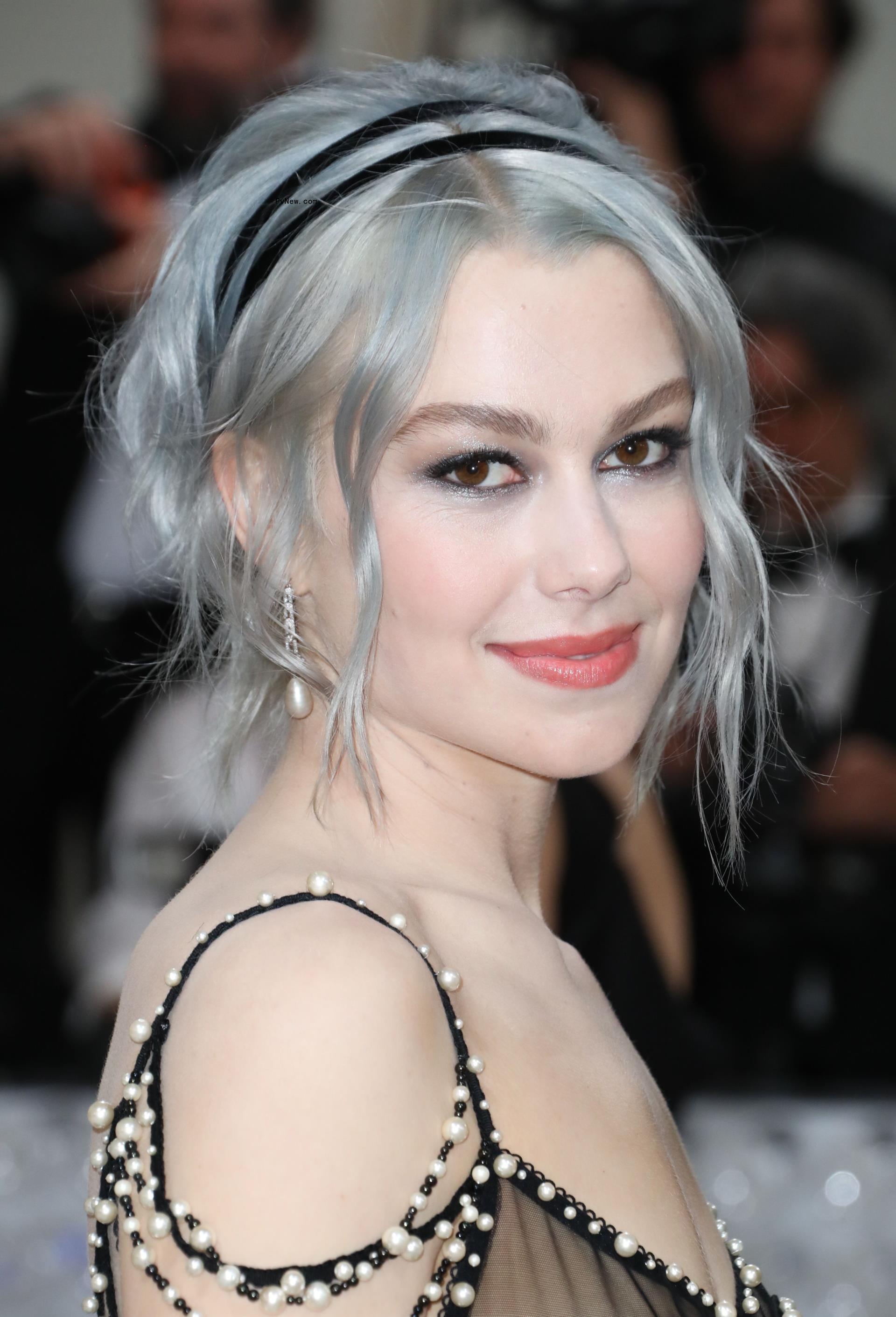 A closeup of Phoebe Bridgers' face on the Met Gala 2023 red carpet