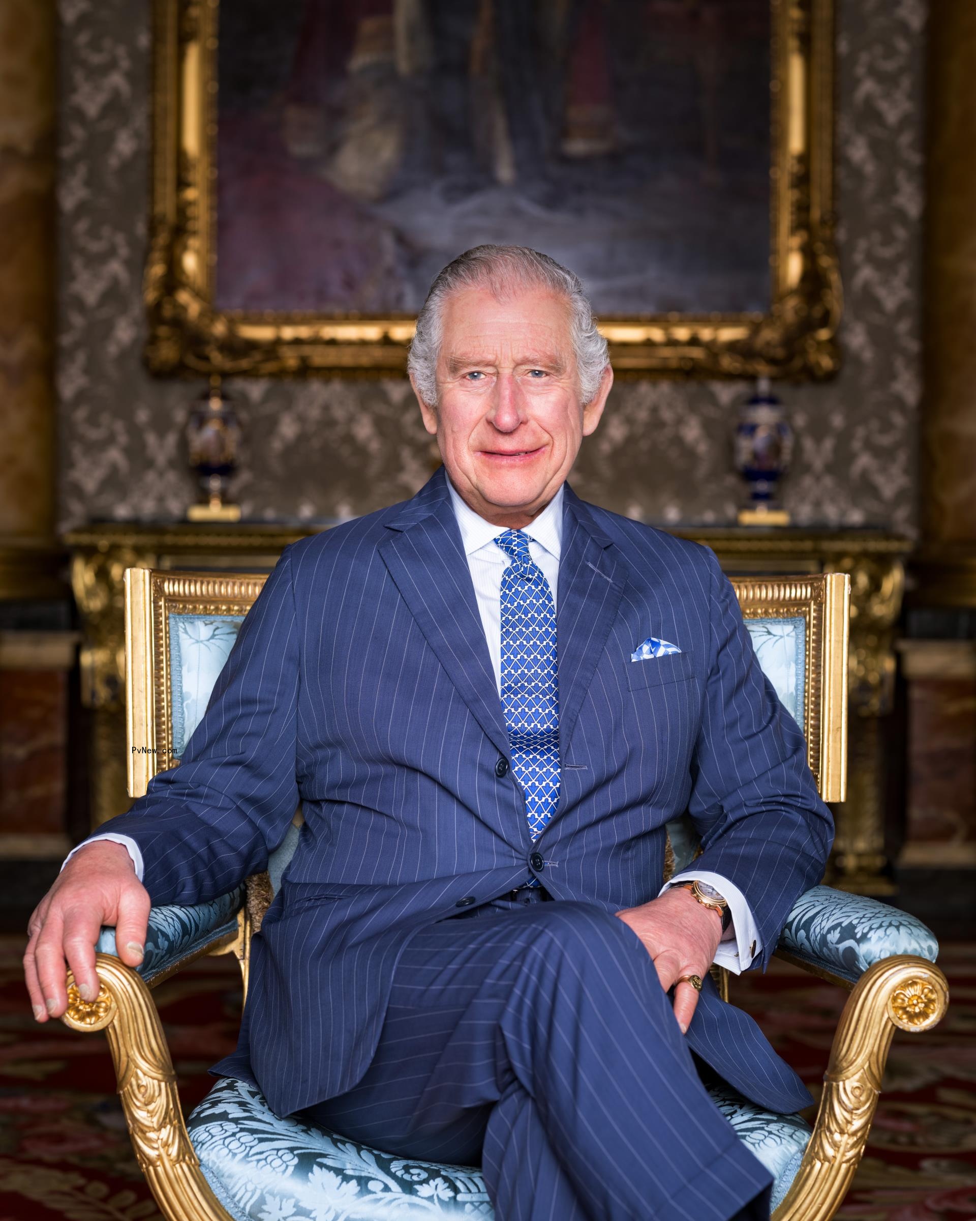 king charles iii sitting in a chair