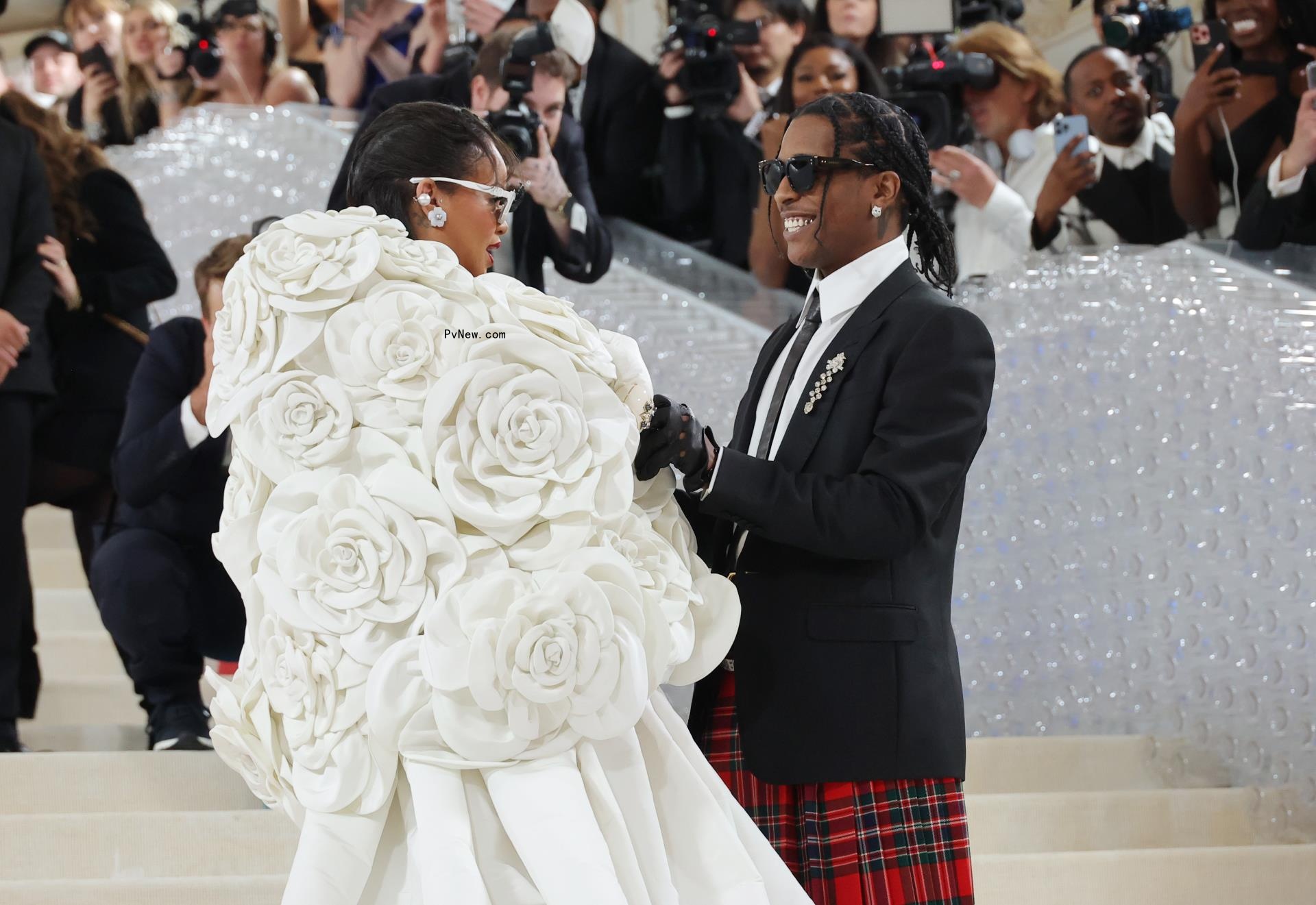 Rihanna and A$AP Rocky at the Met Gala looking at one another