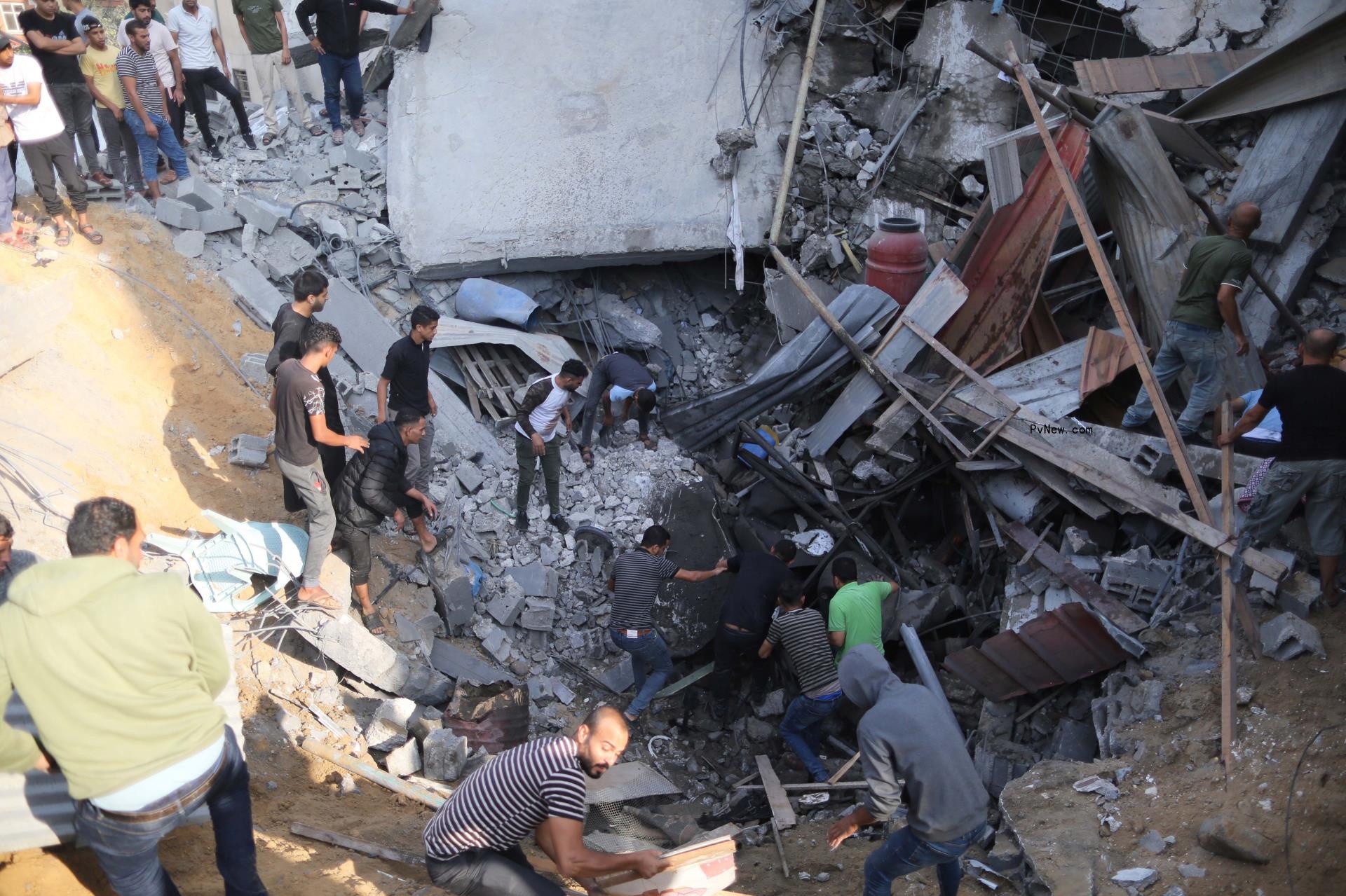 People search for survivors after an Israeli air strike in the southern Gaza Strip