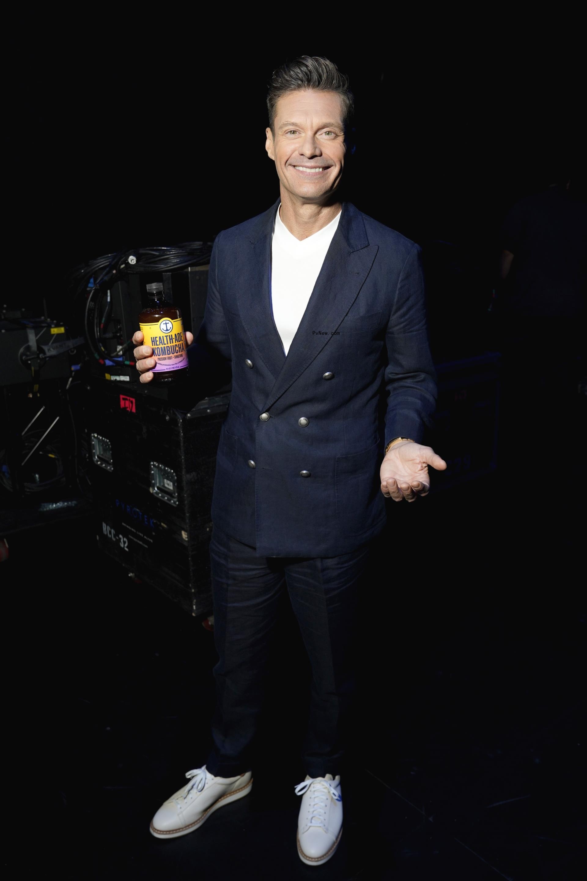 Ryan Seacrest posing for a photo