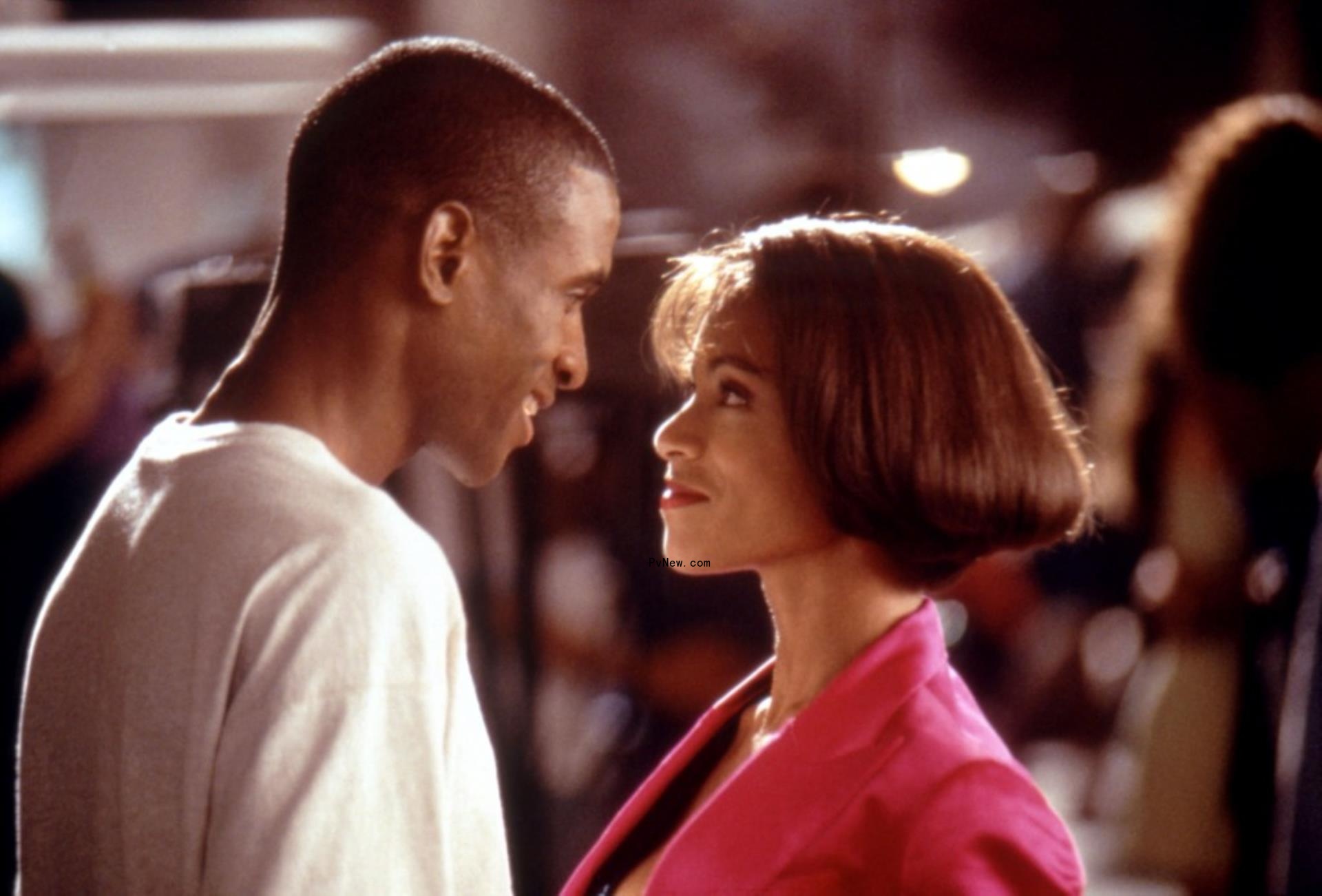 Tommy Davidson and Jada Pinkett Smith staring into each other's eyes in 