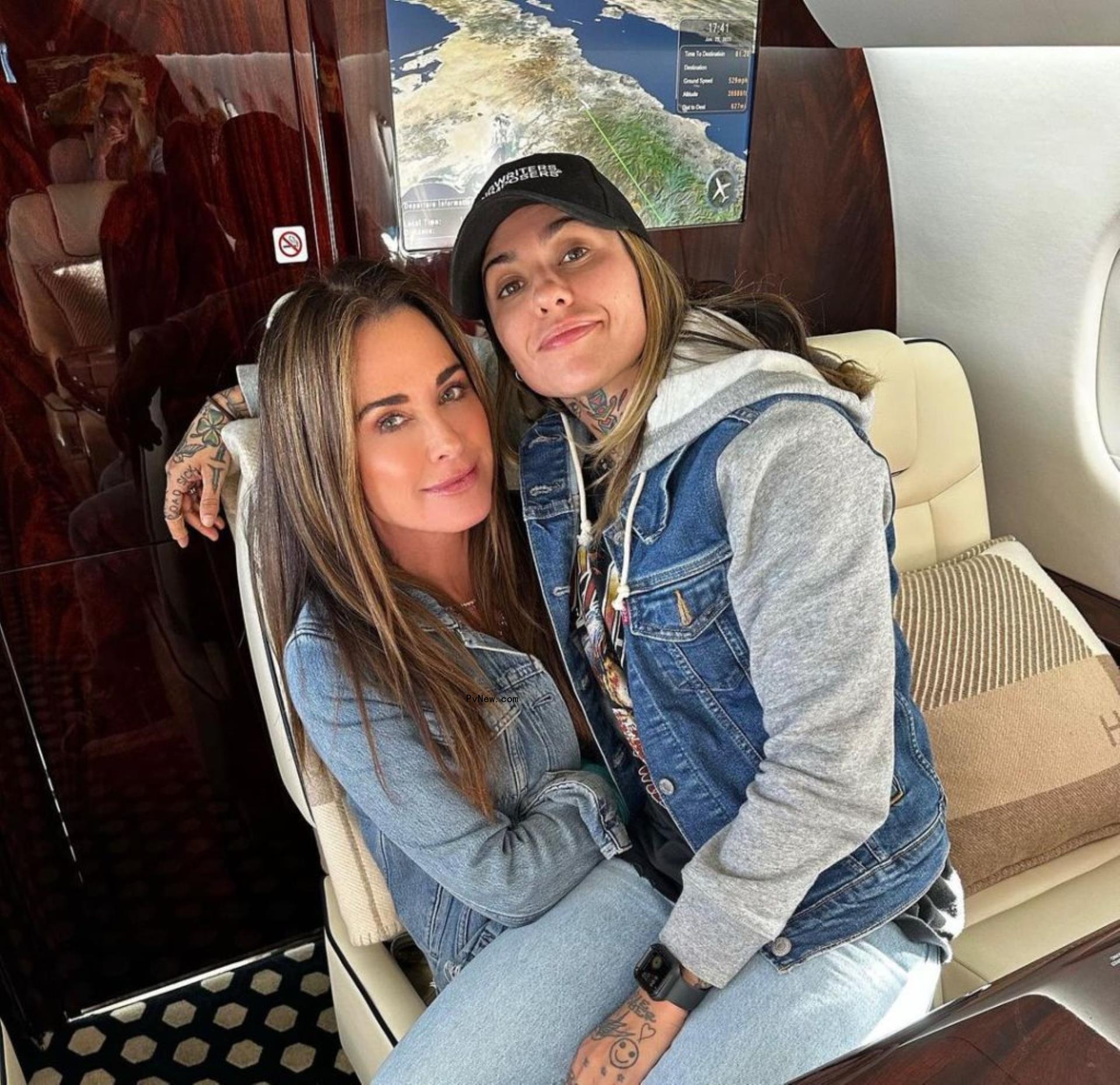 Kyle Richards sits in a chair with Morgan Wade on her lap