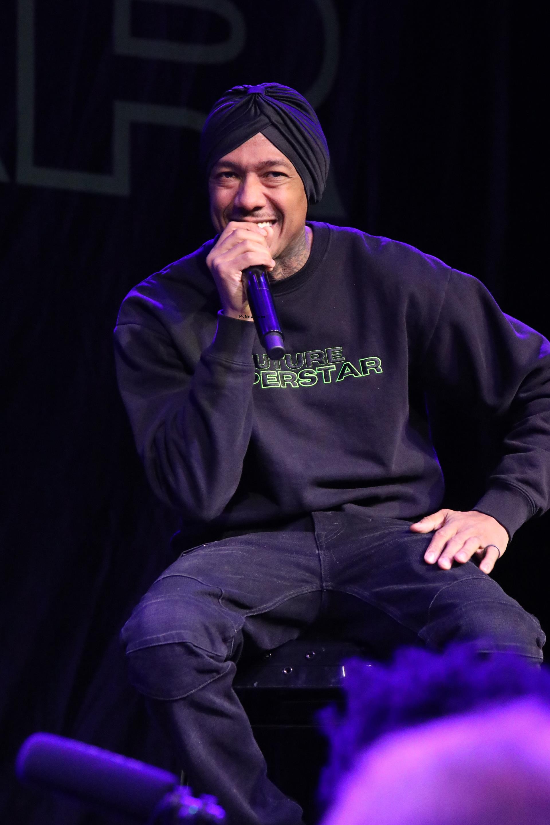 nick cannon with a mic