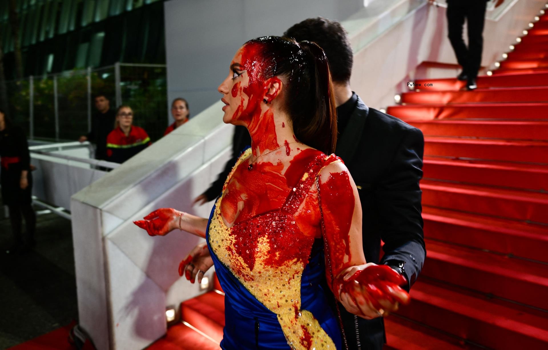 Ukrainian Protester Pulled Off Cannes Red Carpet After Covering Herself in Fake Blood