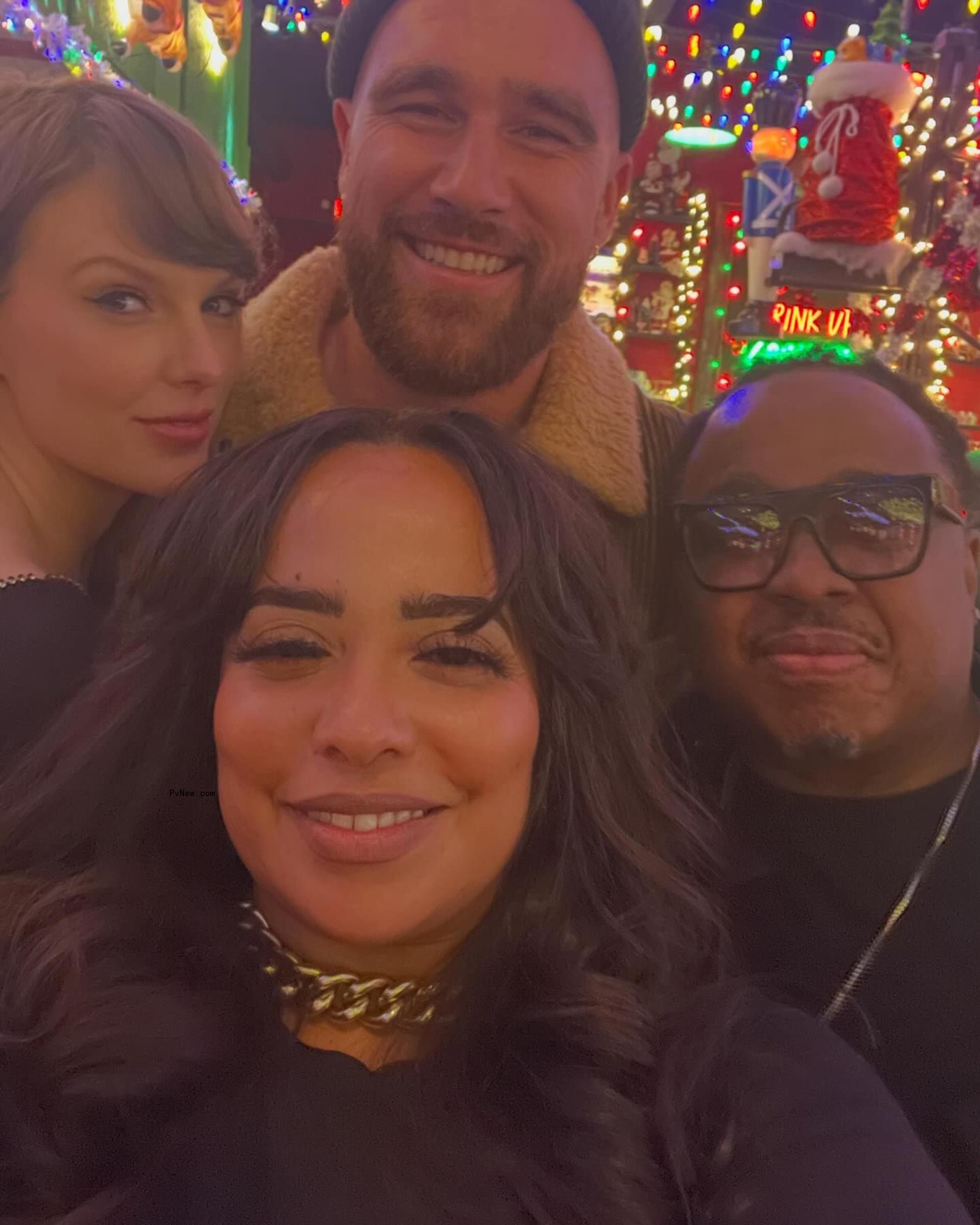 A selfie of Travis Kelce, Taylor Swift, Chetarah Jackson and an unidentified man.