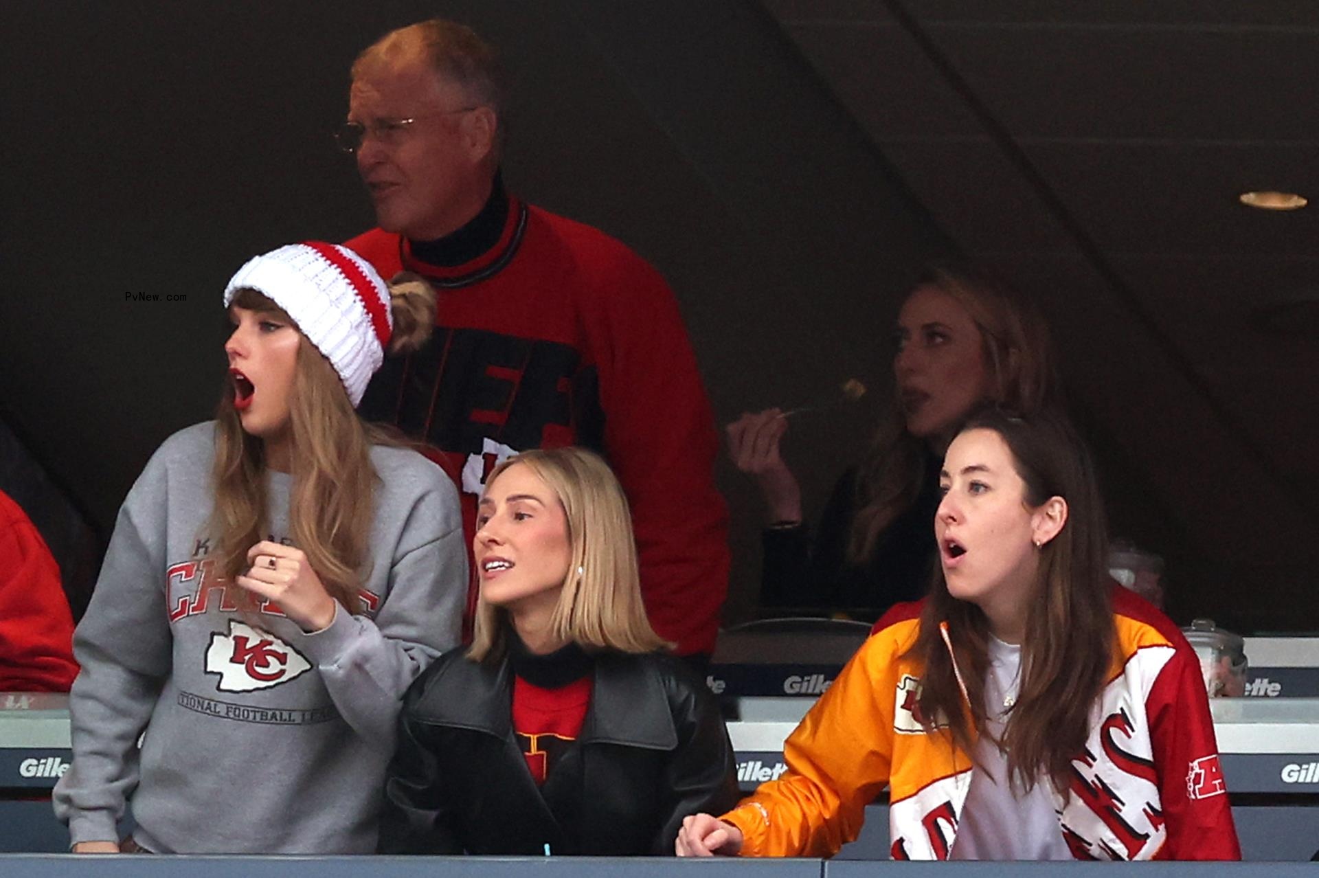 Taylor Swift in stands with friends, father