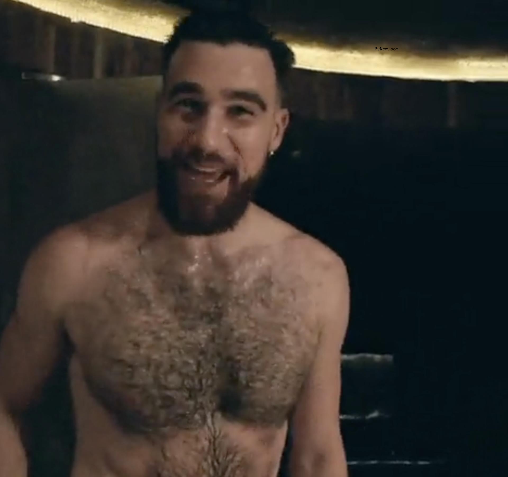 Travis Kelce in a towel