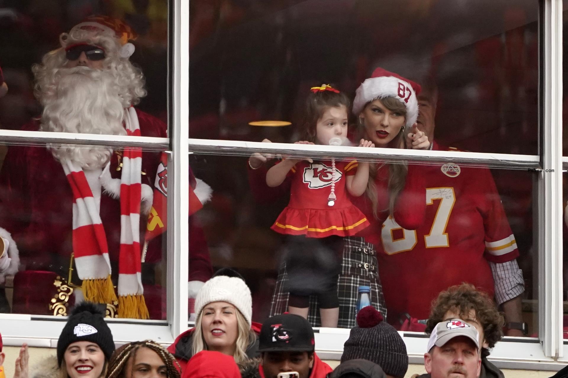 Taylor Swift is seen in a suite before the start of an NFL football game between the Kansas City Chiefs and the Las Vegas Raiders Monday, Dec. 25, 2023, in Kansas City, Mo.