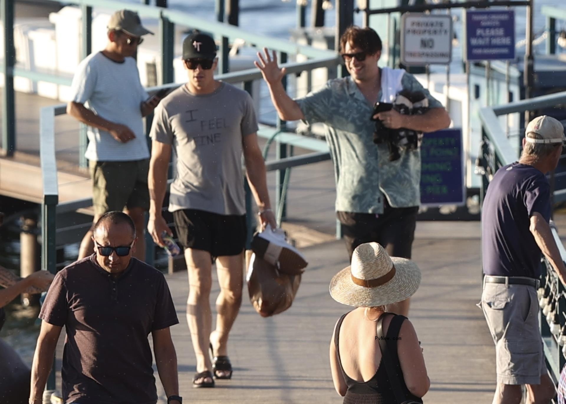 Tom Sandoval and Tom Schwartz walking on a boardwalk 