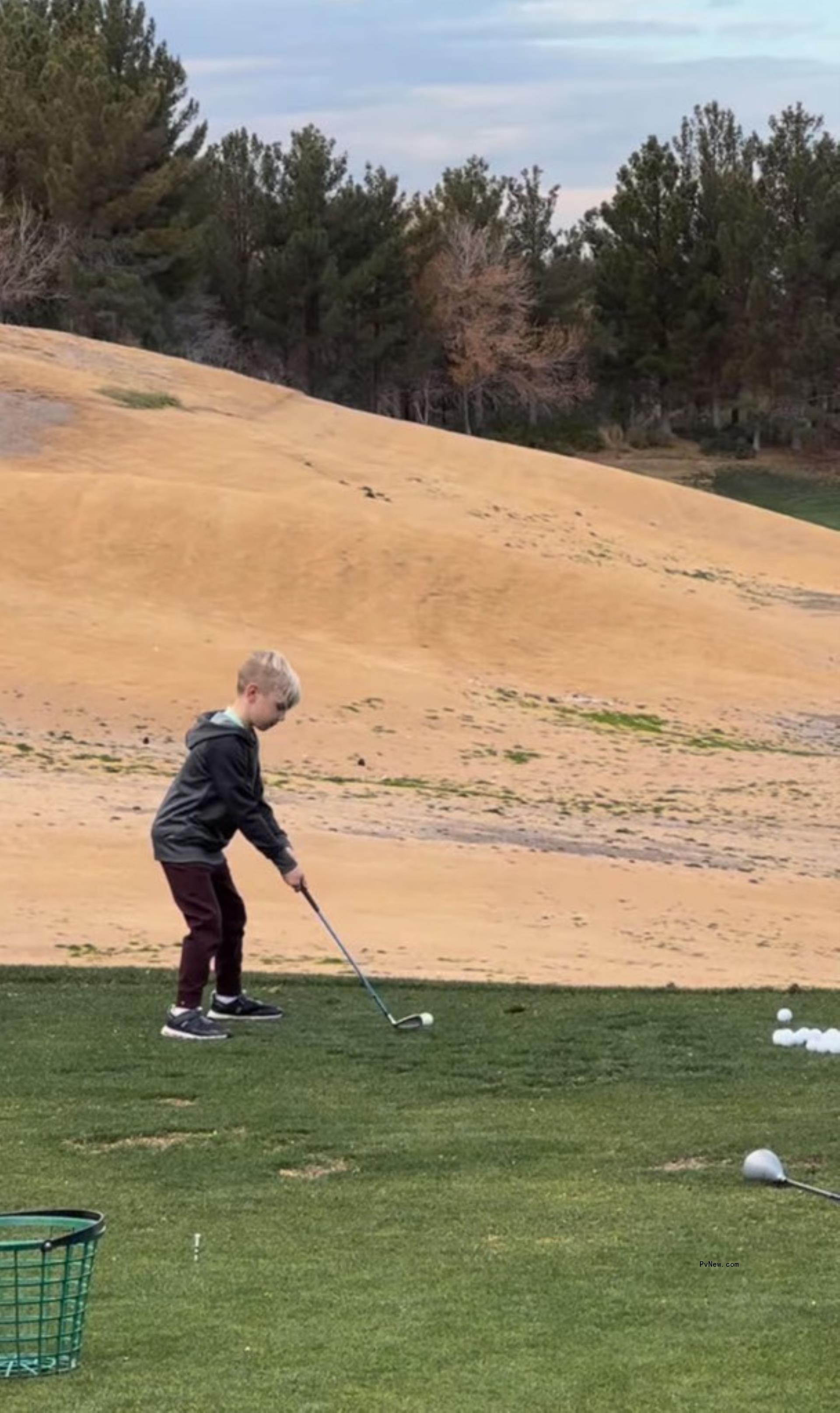 Odin Carter playing golf