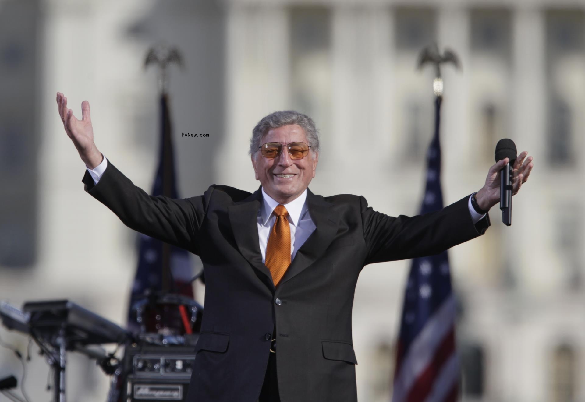 Tony Bennett standing on a stage