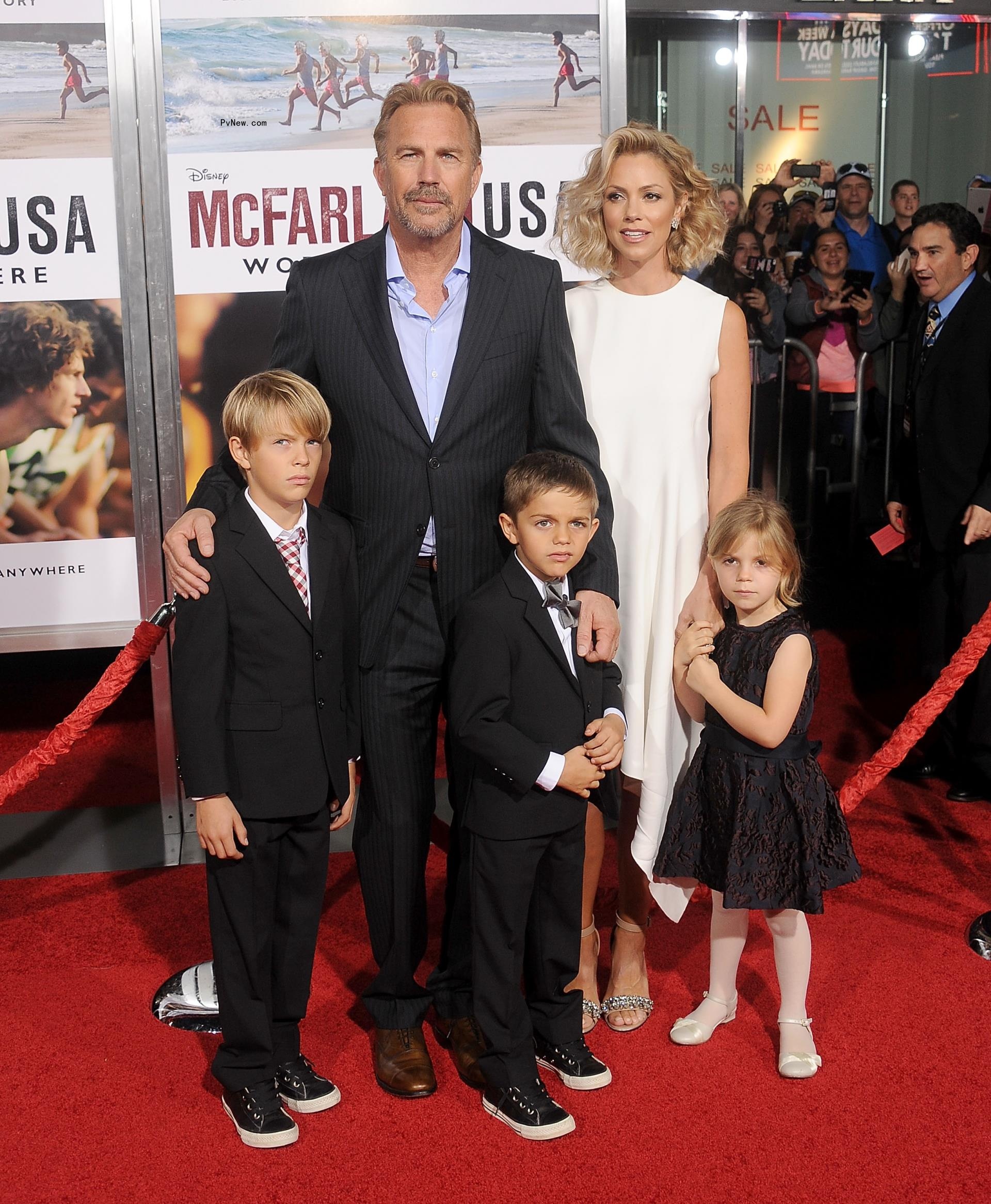 Christine Baumgartner and Kevin with their three kids on a red carpet when they were younger.