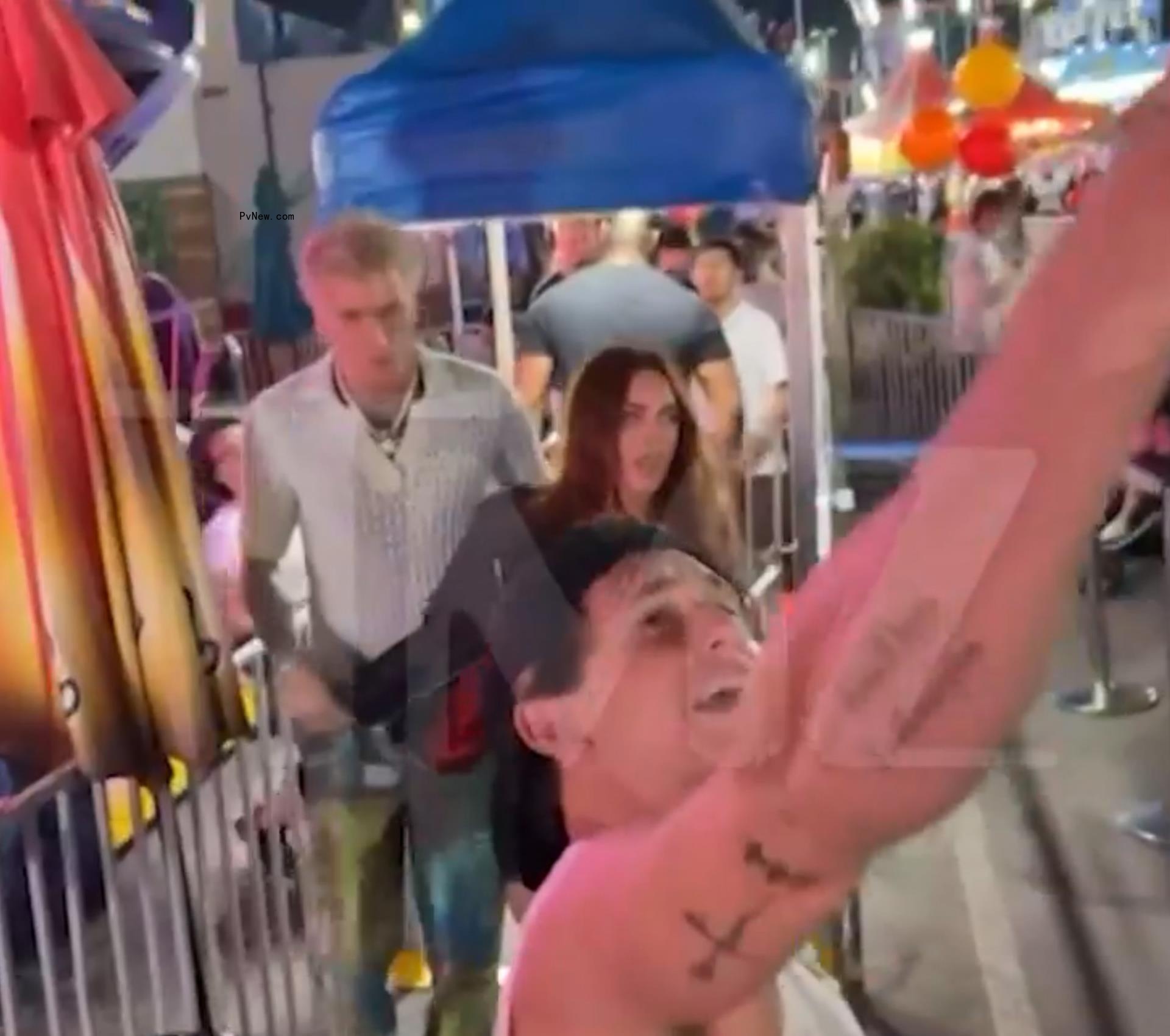 Video grabs of the Machine Gun Kelly OC Fair fight.