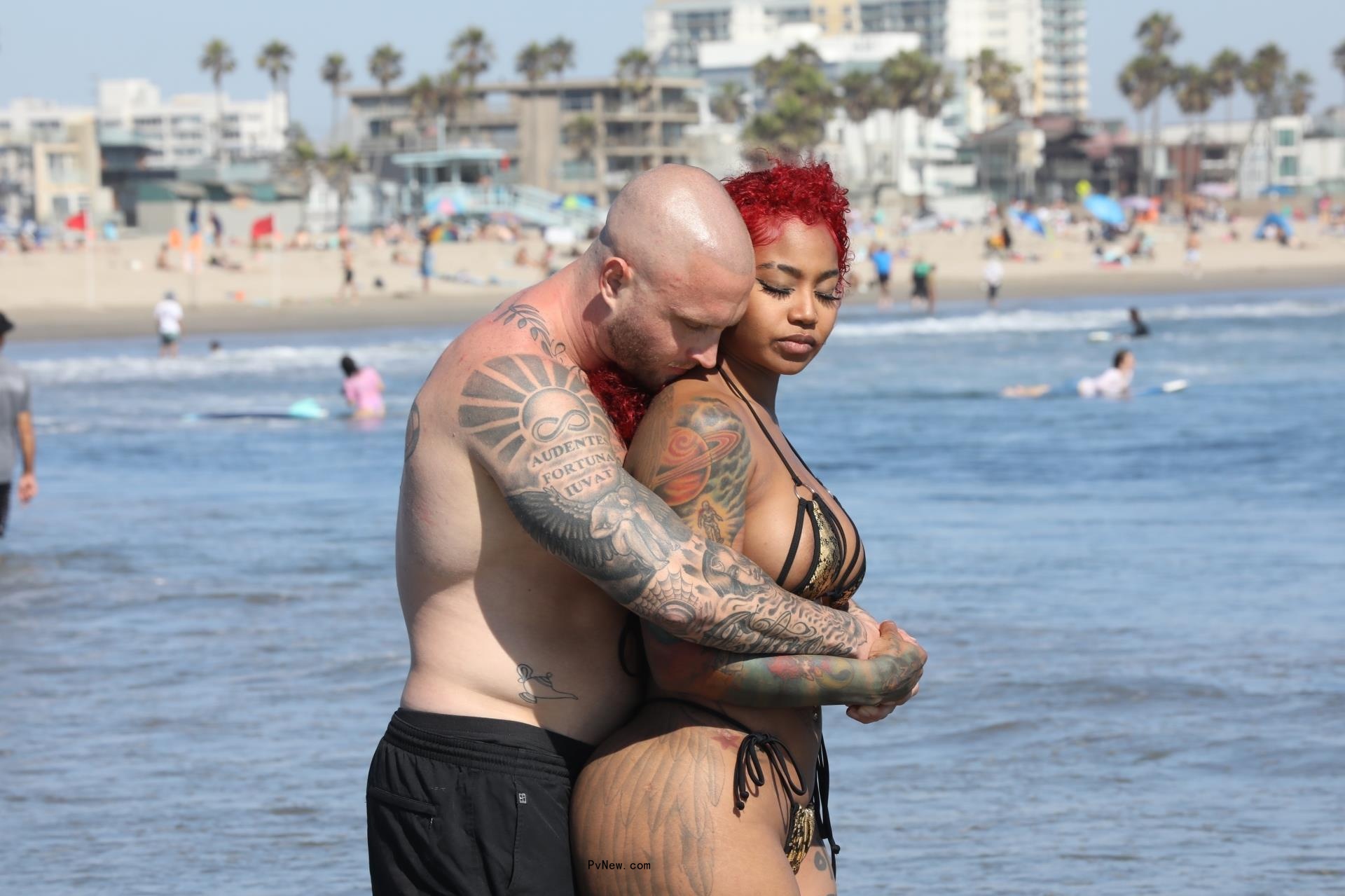 Chet Hanks and Melissa Maysing on the beach.