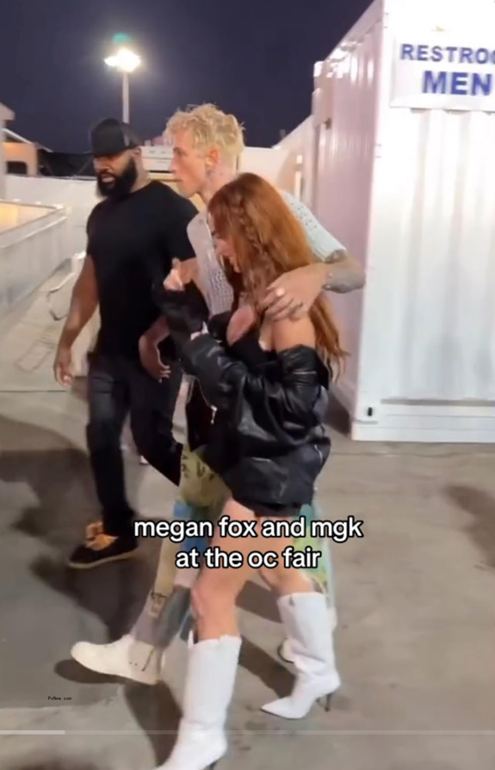 Machine Gun Kelly and Megan Fox walking together