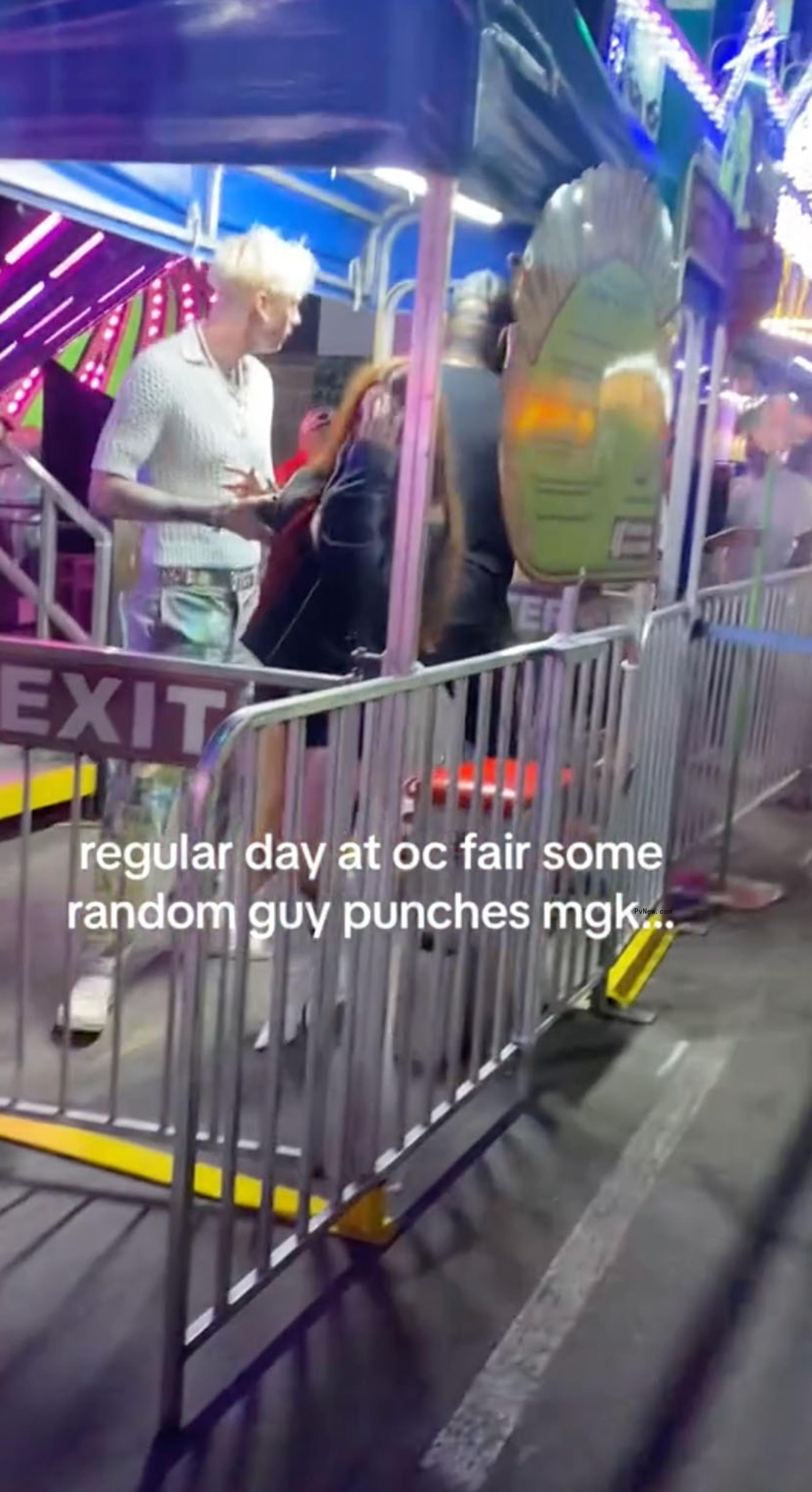 Megan Fox getting slammed into a barricade while at the fair with Machine Gun Kelly.