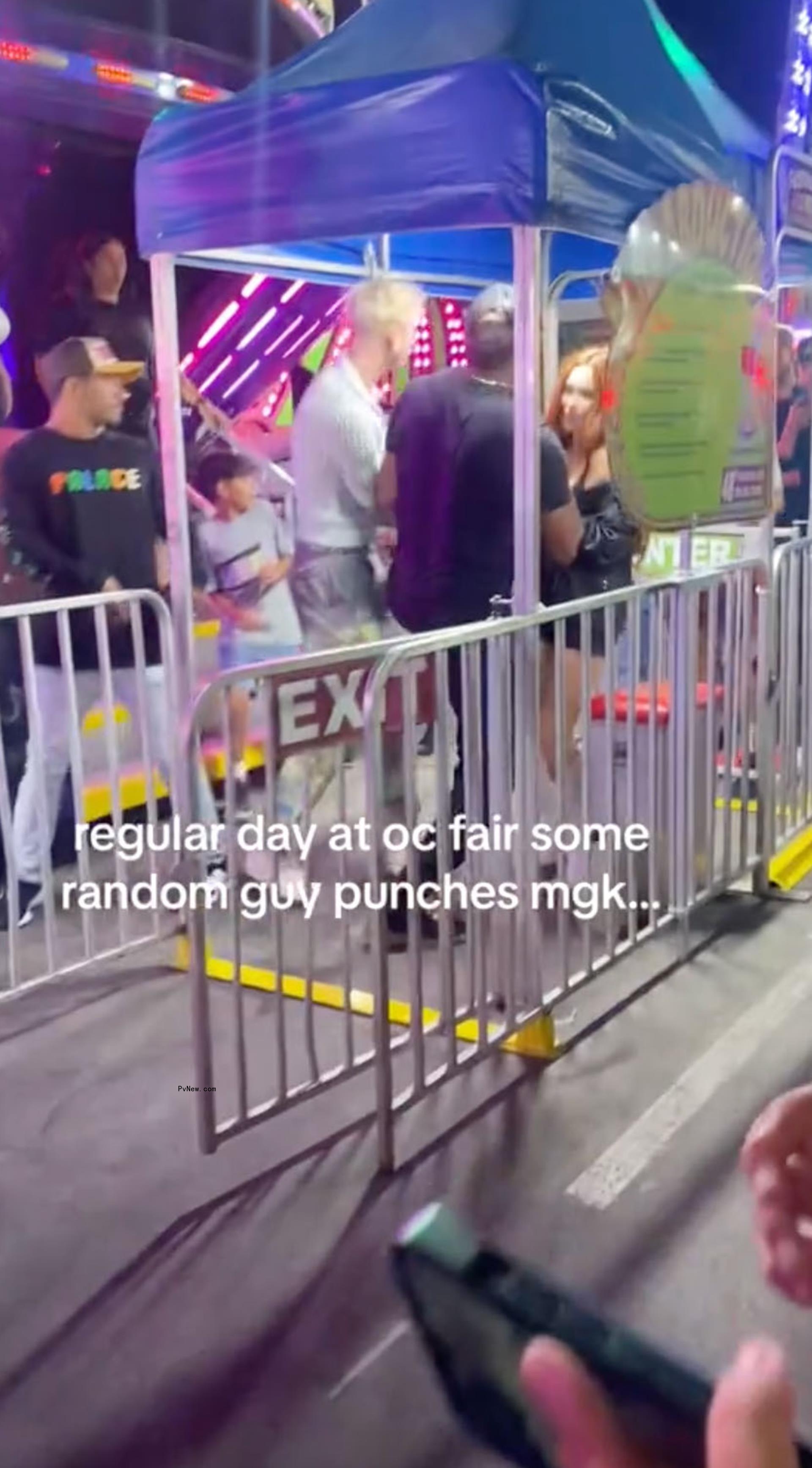 Megan Fox getting slammed into a barricade while at the fair with Machine Gun Kelly.